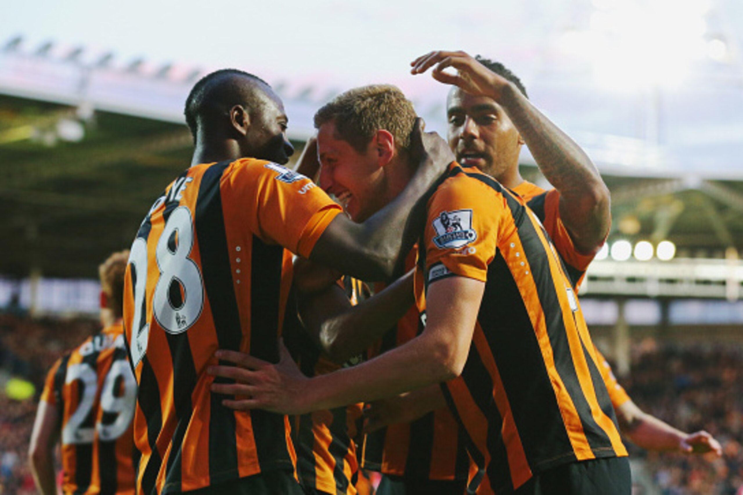 HULL, ENGLAND - APRIL 28:  Michael Dawson of Hull City (C) celebrates with team mates as he scores their first goal during the Barclays Premier League match between Hull City and Liverpool at KC Stadium on April 28, 2015 in Hull, England.  (Photo by Alex 