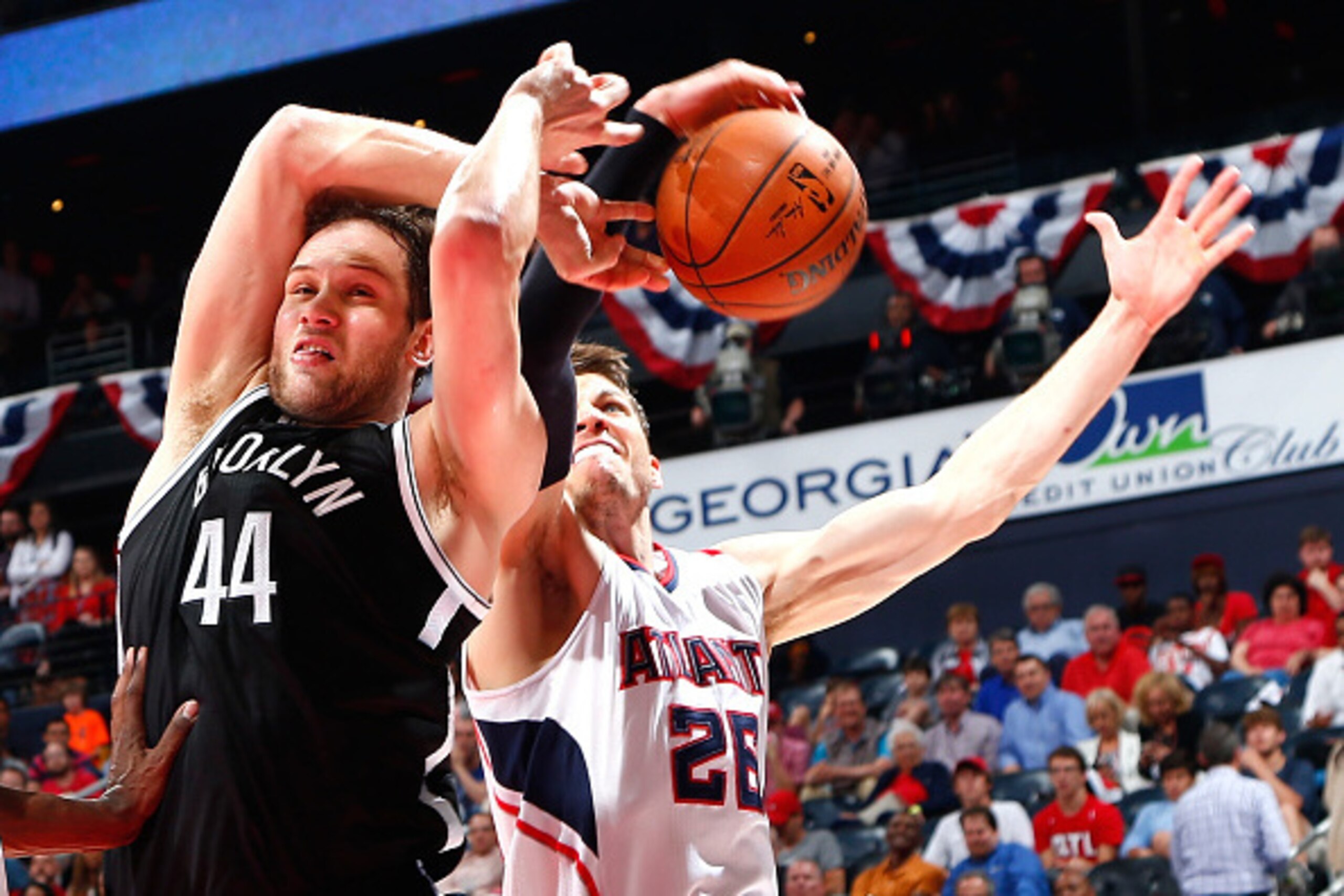 ATLANTA, GA - APRIL 22:  Bojan Bogdanovic #44 of the Brooklyn Nets draws a foul as Kyle Korver #26 of the Atlanta Hawks attempts to strip the ball during Game Two of the Eastern Conference Quarterfinals of the NBA Playoffs at Philips Arena on April 22, 20