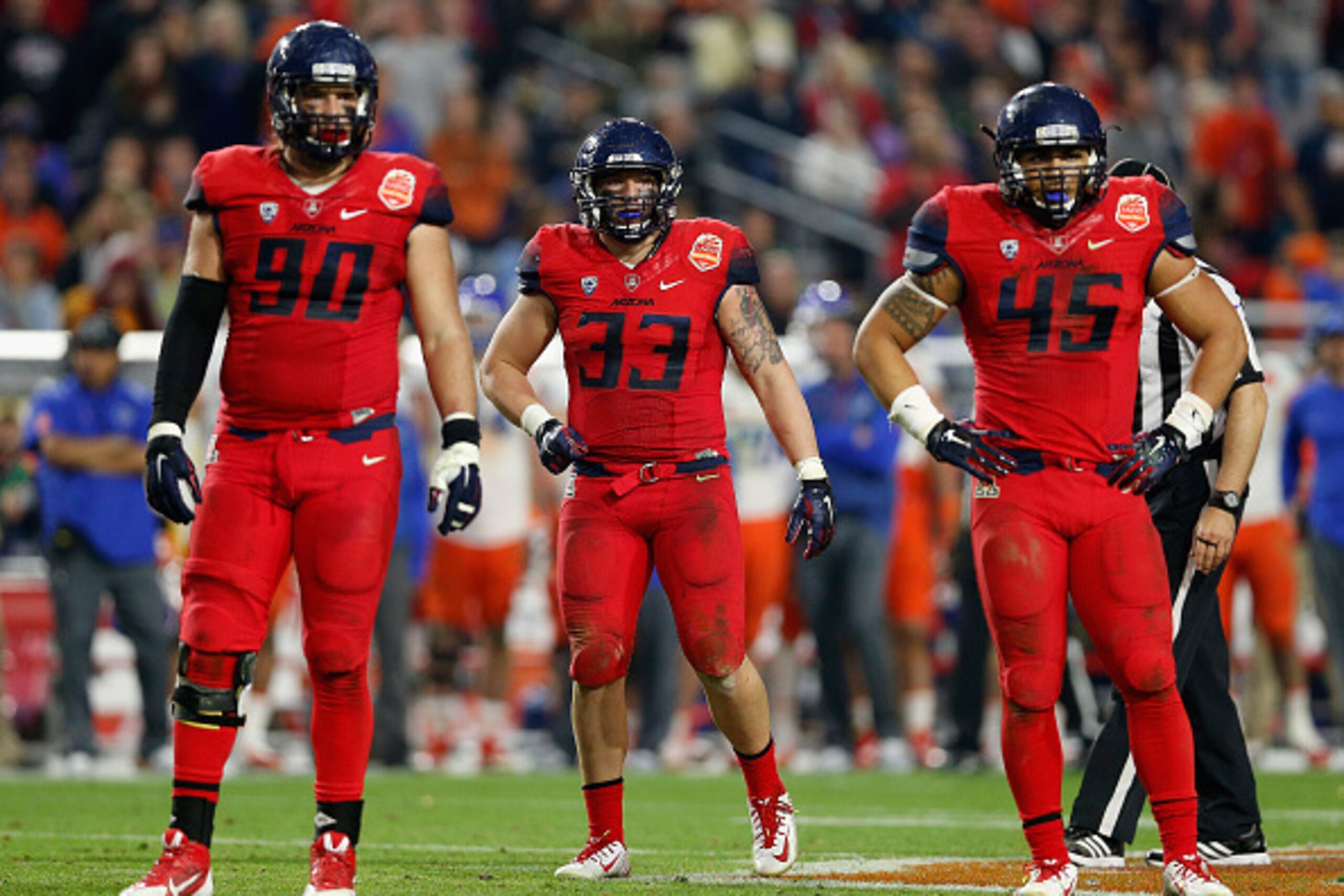 GLENDALE, AZ - DECEMBER 31: (L-R) Defensive lineman Dan Pettinato #90, inebacker Scooby Wright III #33 and linebacker Derrick Turituri #45 of the Arizona Wildcats during the Vizio Fiesta Bowl against the Boise State Broncos at University of Phoenix Stadi GLENDALE, AZ - DECEMBER 31: (L-R) Defensive lineman Dan Pettinato #90, inebacker Scooby Wright III #33 and linebacker Derrick Turituri #45 of the Arizona Wildcats during the Vizio Fiesta Bowl against the Boise State Broncos at University of Phoenix Stadi