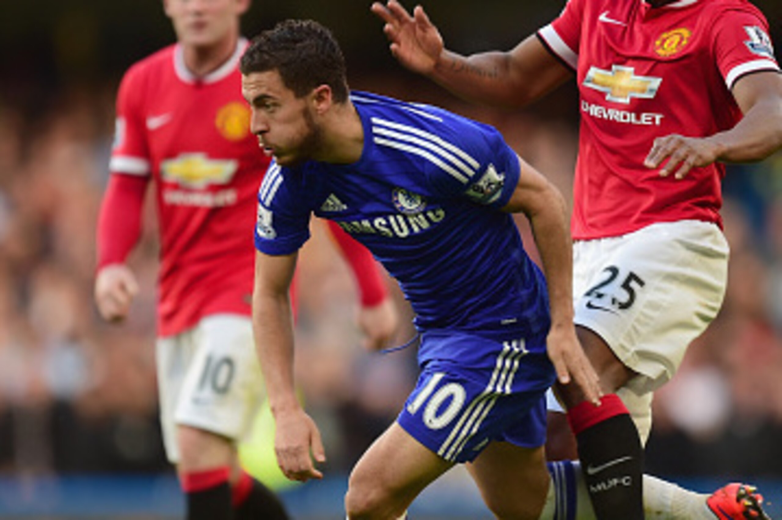 LONDON, ENGLAND - APRIL 18:  Eden Hazard of Chelsea and Luis Antonio Valencia of Manchester United fight for the ball during the Barclays Premier League match between Chelsea and Manchester United at Stamford Bridge on April 18, 2015 in London, England.  