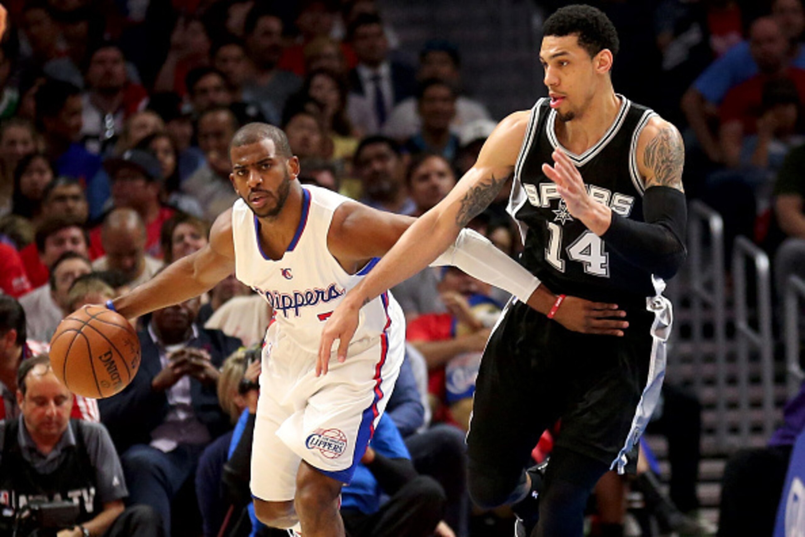 LOS ANGELES, CA - APRIL 28: Chris Paul #3 of the Los Angeles Clippers control the ball against Danny Green #14 of the San Antonio Spurs during Game Five of the Western Conference quarterfinals of the 2015 NBA Playoffs at Staples Center on April 28, 2015 LOS ANGELES, CA - APRIL 28: Chris Paul #3 of the Los Angeles Clippers control the ball against Danny Green #14 of the San Antonio Spurs during Game Five of the Western Conference quarterfinals of the 2015 NBA Playoffs at Staples Center on April 28, 2015