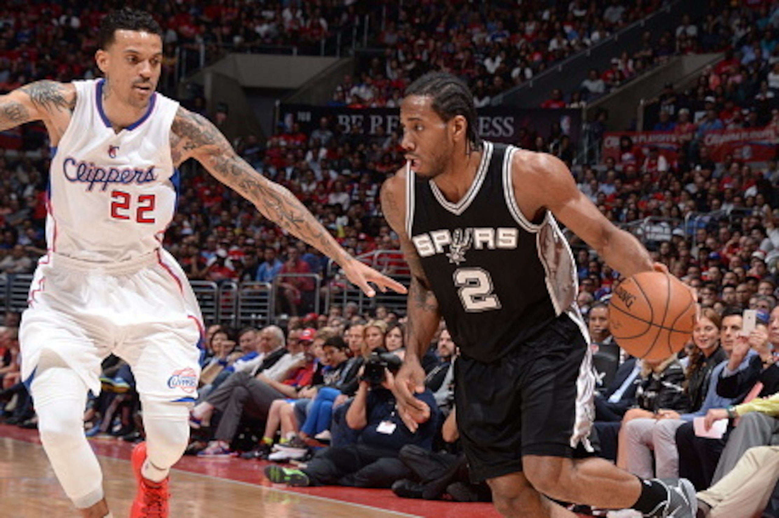 LOS ANGELES, CA - APRIL 28:  Kawhi Leonard #2 of the San Antonio Spurs drives to the basket Matt Barnes #22 of the Los Angeles Clippers in Game Five of the Western Conference Quarterfinals during the 2015 NBA Playoffs on April 28, 2015 at Staples Center i