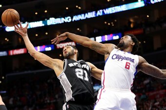 LOS ANGELES, CA - APRIL 28:  Tim Duncan #21 of the San Antonio Spurs goes for a rebound against DeAndre Jordan #6 of the Los Angeles Clippers during Game Five of the Western Conference quarterfinals of the 2015 NBA Playoffs at Staples Center on April 28,