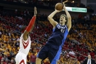 Apr 28, 2015; Houston, TX, USA; Dallas Mavericks forward Dirk Nowitzki (41) attempts a shot during the fourth quarter as Houston Rockets forward Josh Smith (5) defends in game five of the first round of the NBA Playoffs at Toyota Center. The Rockets defea