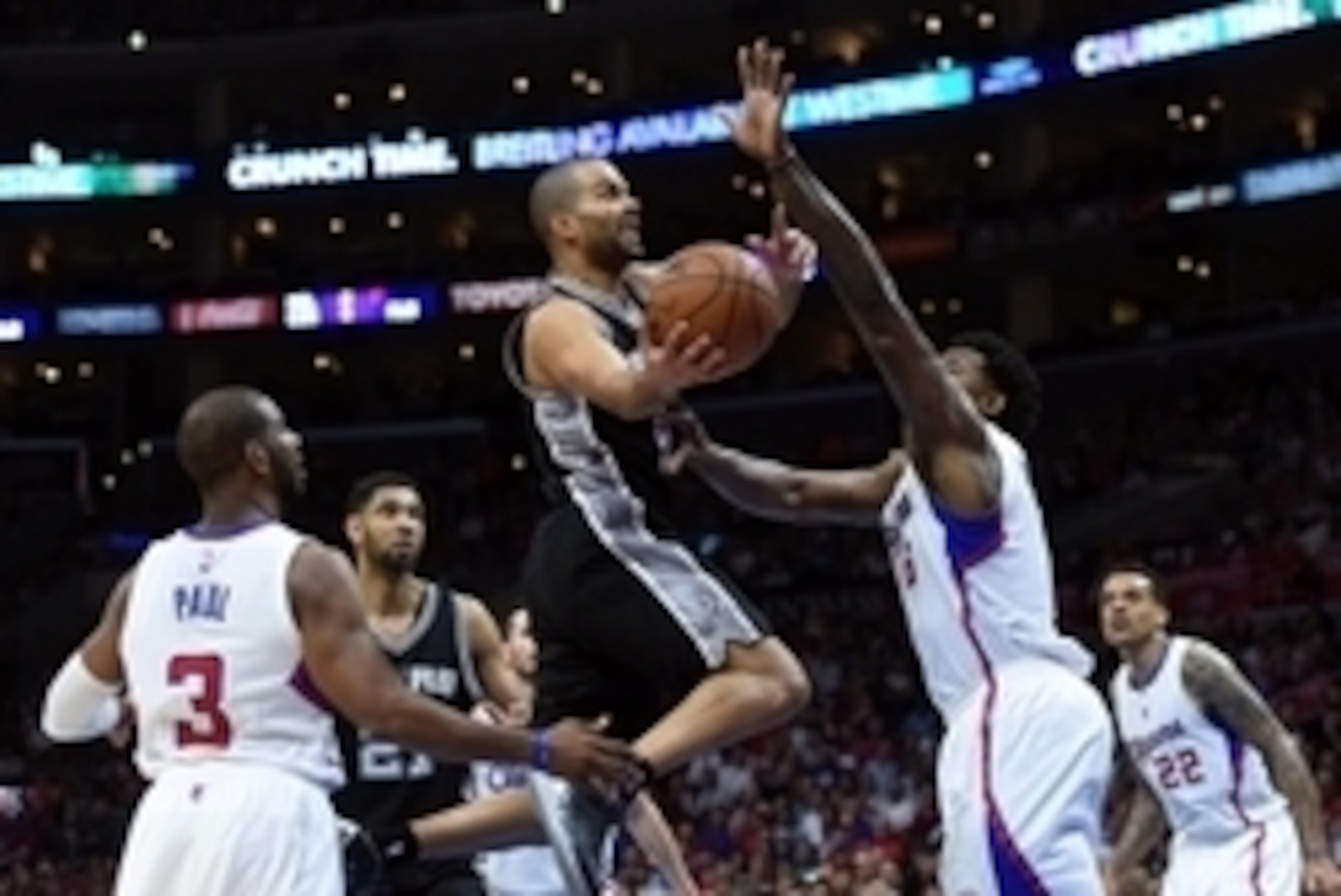 Apr 28, 2015; Los Angeles, CA, USA; San Antonio Spurs guard Tony Parker (9) is defended by Los Angeles Clippers guard Chris Paul (3) and center DeAndre Jordan (6) in game five of the first round of the NBA Playoffs at Staples Center. The Spurs defeated th