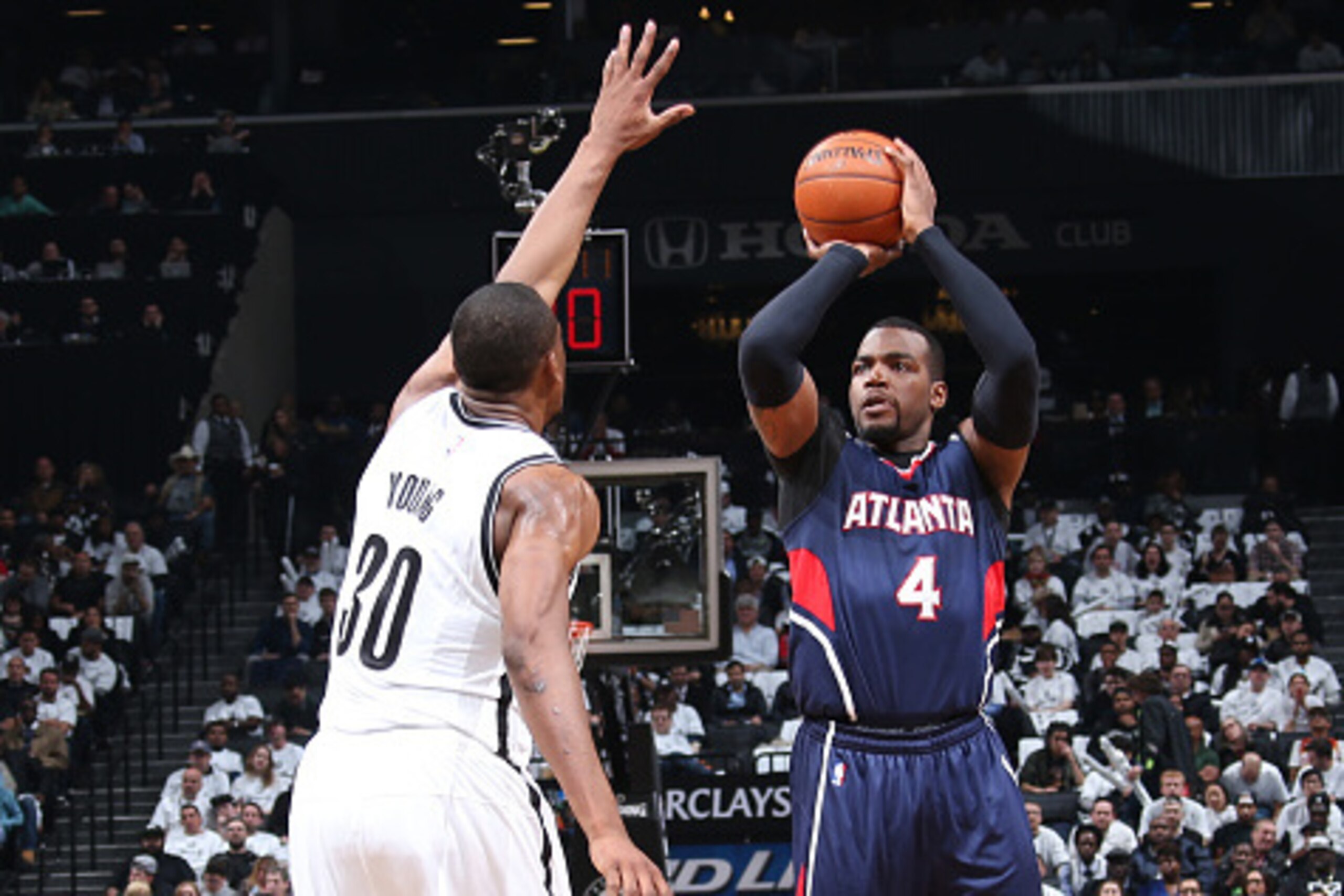 BROOKLYN, NY - APRIL 27: Paul Millsap #4 of the Atlanta Hawks shoots against the Brooklyn Nets during Game Four of the Eastern Conference Quarterfinals during the NBA Playoffs on April 27, 2015 at Barclays Center in Brooklyn, NY. NOTE TO USER: User expres