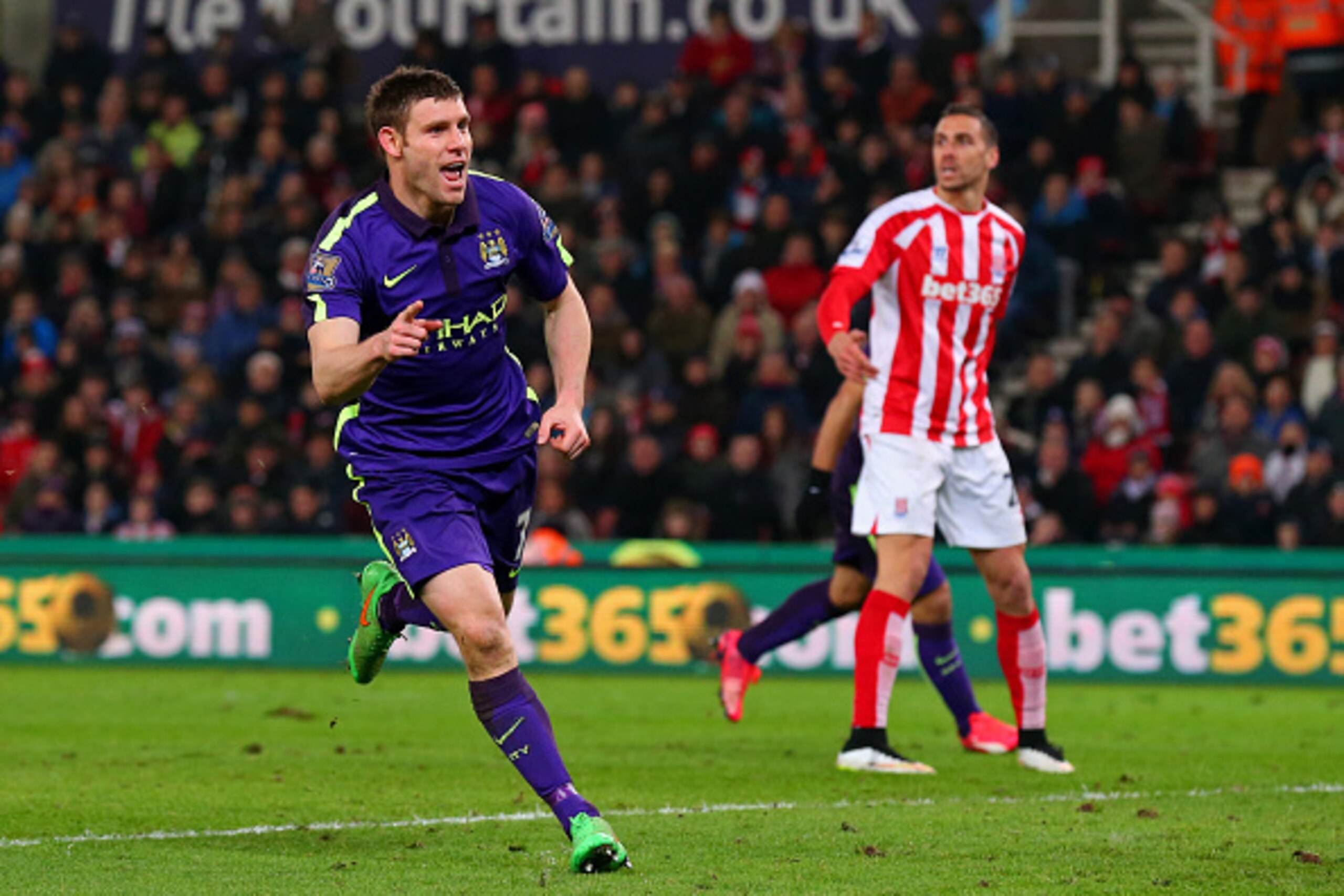 STOKE ON TRENT, ENGLAND - FEBRUARY 11: James Milner of Manchester City celebrates after scoring his team's second goal during the Barclays Premier League match between Stoke City and Manchester City at Britannia Stadium on February 11, 2015 in Stoke on T STOKE ON TRENT, ENGLAND - FEBRUARY 11: James Milner of Manchester City celebrates after scoring his team's second goal during the Barclays Premier League match between Stoke City and Manchester City at Britannia Stadium on February 11, 2015 in Stoke on T