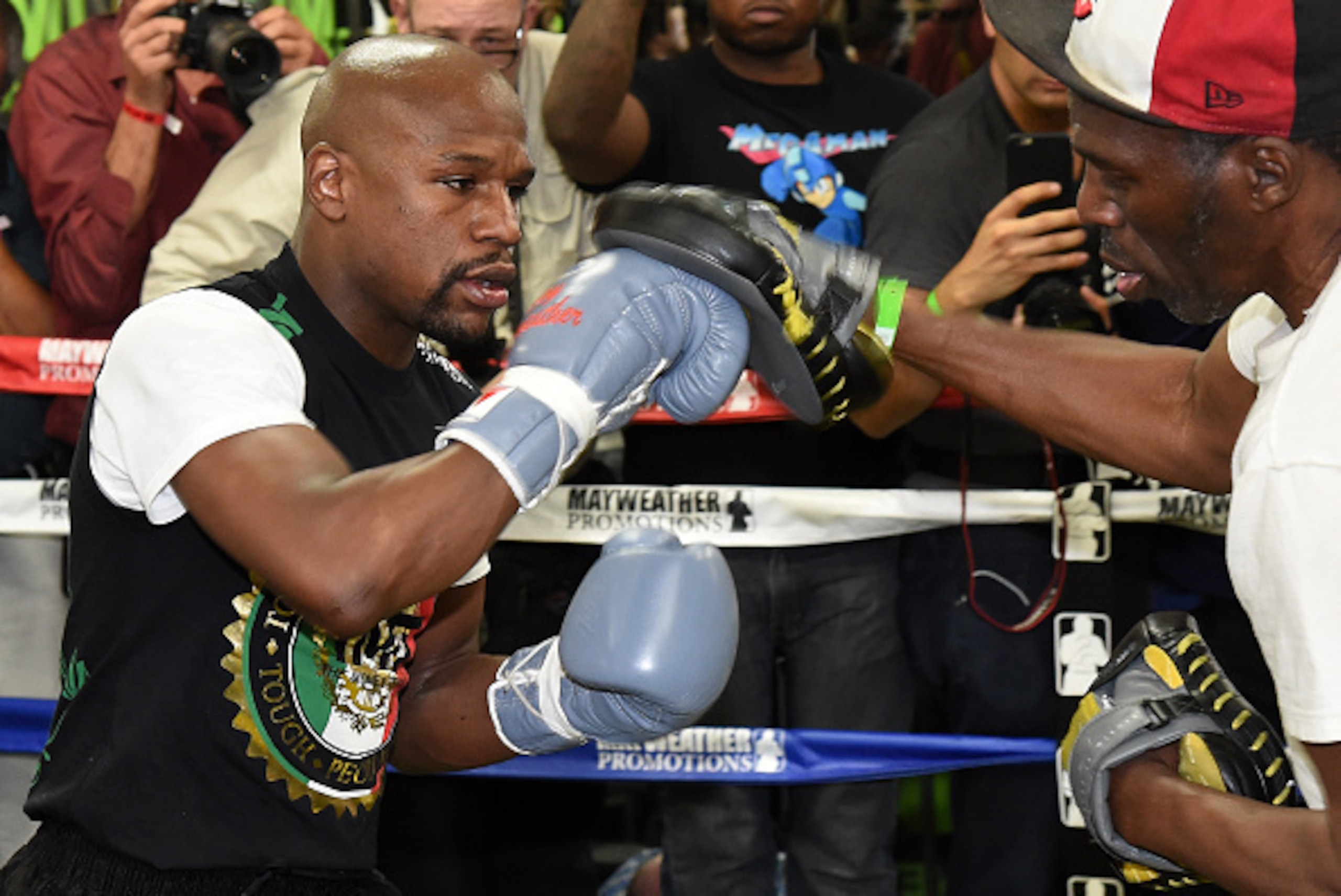 LAS VEGAS, NV - APRIL 14: WBC/WBA welterweight champion Floyd Mayweather Jr. (L) works out with his uncle Roger Mayweather at the Mayweather Boxing Club on April 14, 2015 in Las Vegas, Nevada. Mayweather Jr. will face WBO welterweight champion Manny Pacq LAS VEGAS, NV - APRIL 14: WBC/WBA welterweight champion Floyd Mayweather Jr. (L) works out with his uncle Roger Mayweather at the Mayweather Boxing Club on April 14, 2015 in Las Vegas, Nevada. Mayweather Jr. will face WBO welterweight champion Manny Pacq