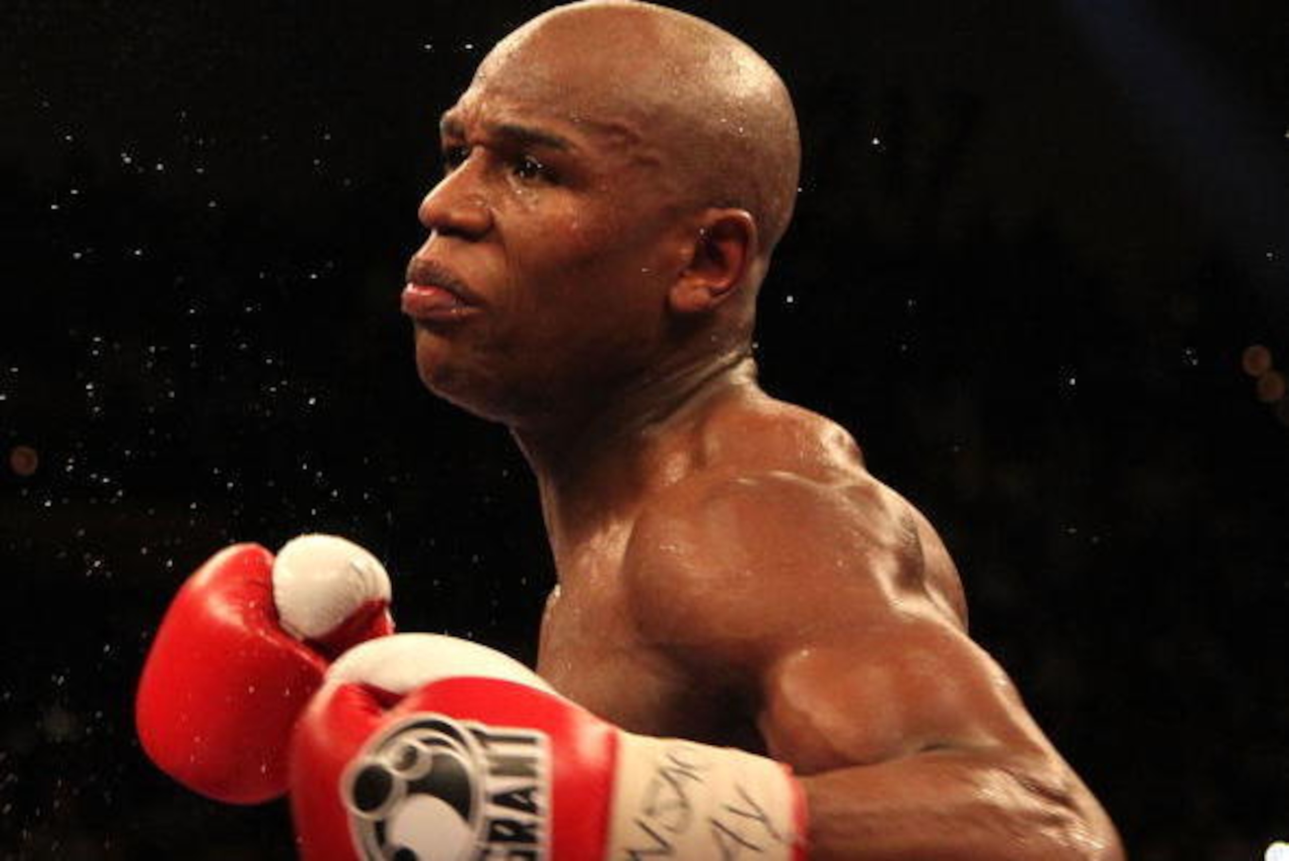 LAS VEGAS - MAY 01: (R-L) Floyd Mayweather Jr. in action against Shane Mosley during their welterweight fight at the MGM Grand Garden Arena on May 1, 2010 in Las Vegas, Nevada. Mayweather Jr. defeated Mosley by unanimous decison. (Photo by Jed Jacobsohn LAS VEGAS - MAY 01: (R-L) Floyd Mayweather Jr. in action against Shane Mosley during their welterweight fight at the MGM Grand Garden Arena on May 1, 2010 in Las Vegas, Nevada. Mayweather Jr. defeated Mosley by unanimous decison. (Photo by Jed Jacobsohn
