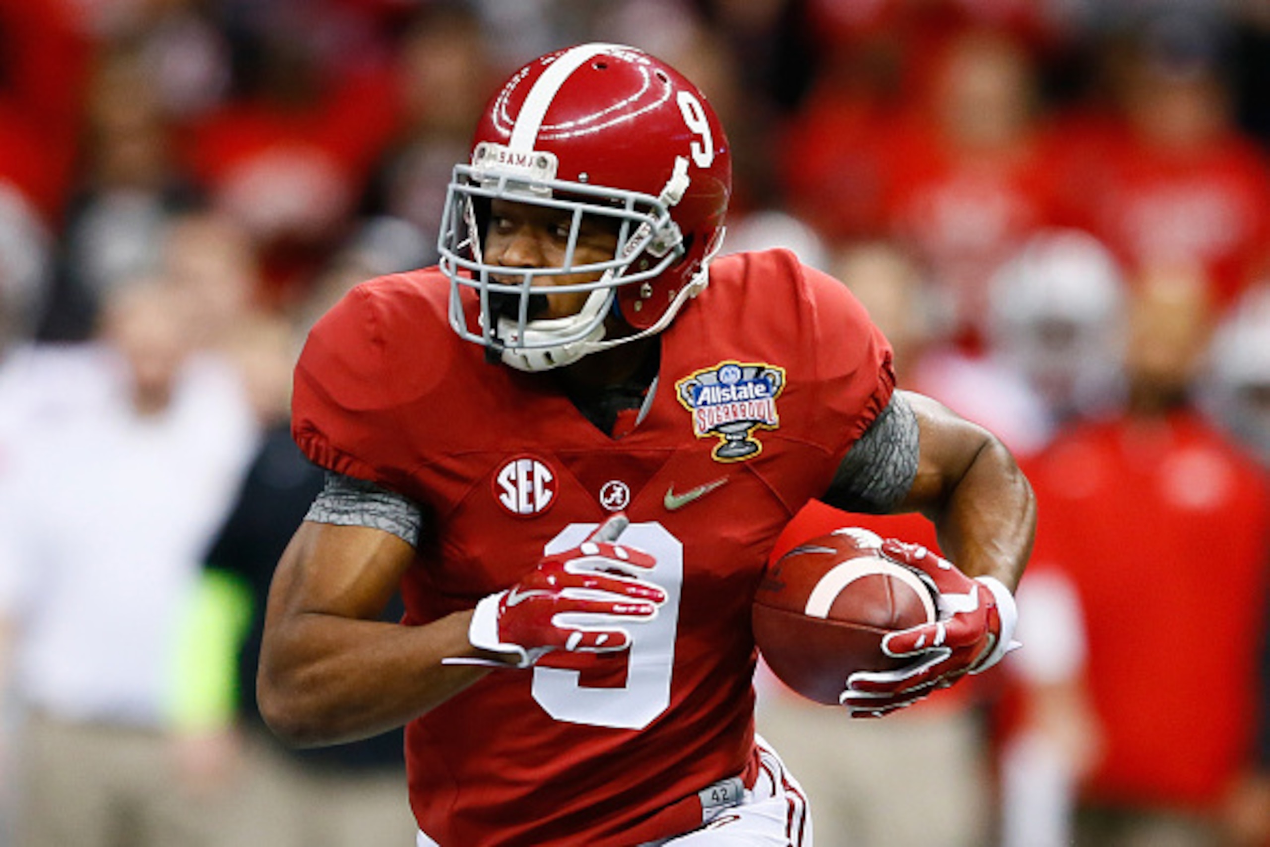 NEW ORLEANS, LA - JANUARY 01:  Amari Cooper #9 of the Alabama Crimson Tide runs the ball in the first quarter against the Ohio State Buckeyes during the All State Sugar Bowl at the Mercedes-Benz Superdome on January 1, 2015 in New Orleans, Louisiana.  (Ph