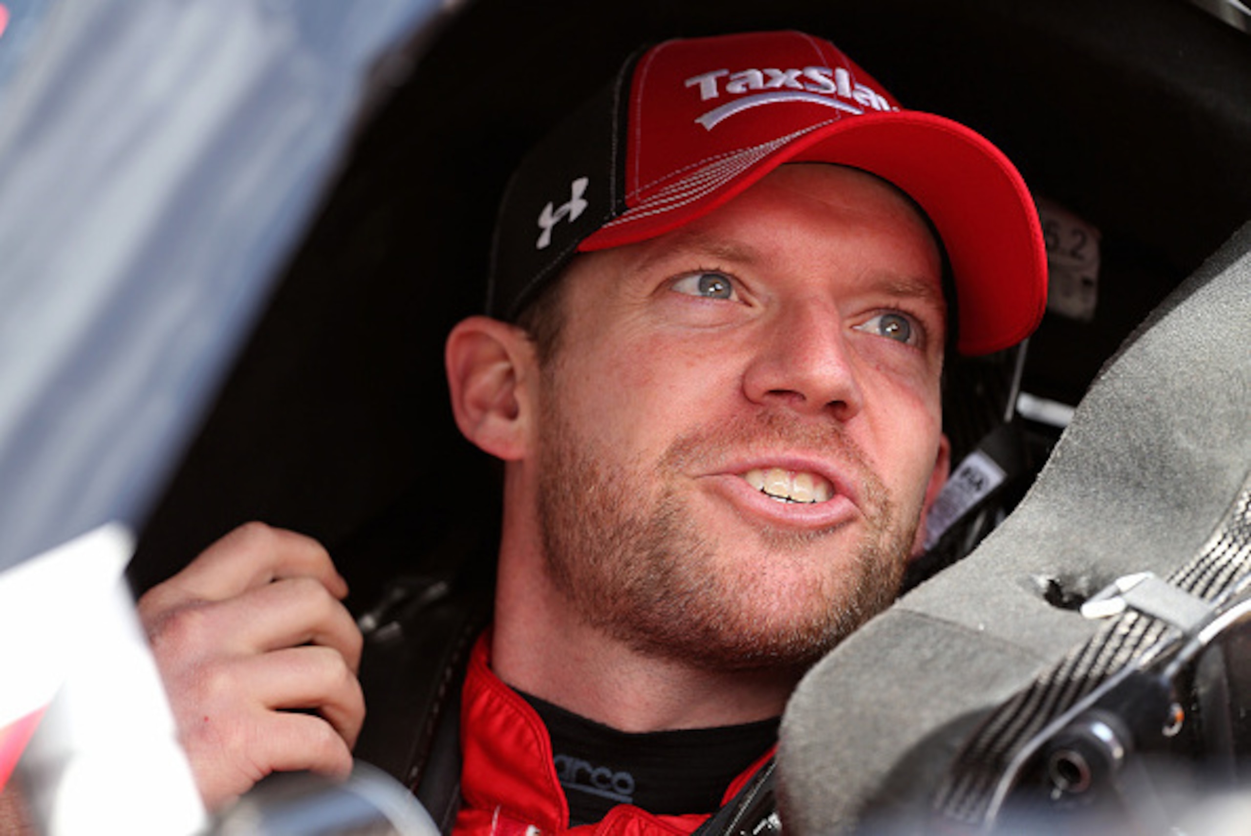 BRISTOL, TN - APRIL 17:  Regan Smith, driver of the #7 TaxSlayer.com Chevrolet, sits in his car during practice for the NASCAR XFINITY Series Drive To Stop Diabetes 300 at Bristol Motor Speedway on April 17, 2015 in Bristol, Tennessee.  (Photo by Mike Ehr