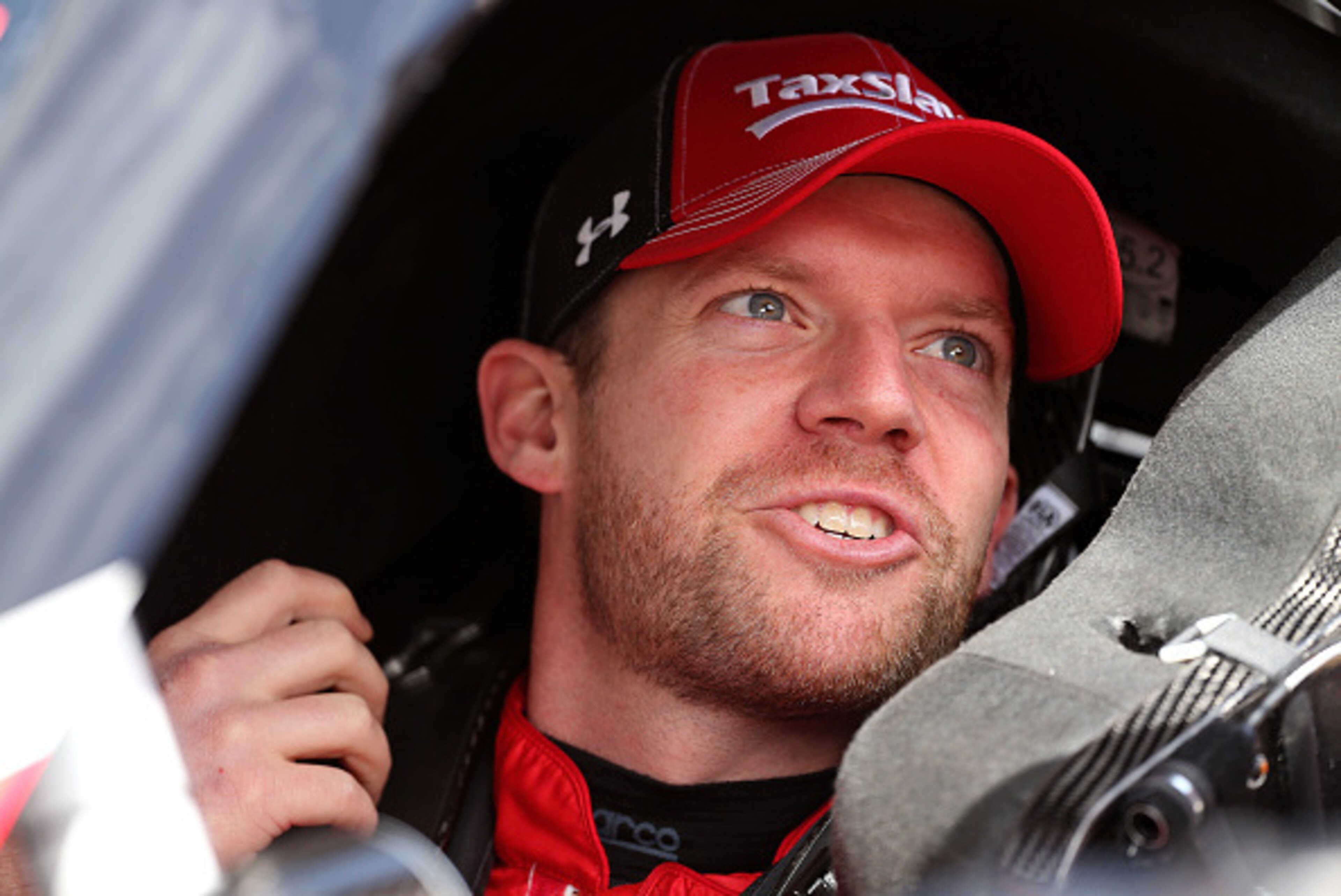 BRISTOL, TN - APRIL 17:  Regan Smith, driver of the #7 TaxSlayer.com Chevrolet, sits in his car during practice for the NASCAR XFINITY Series Drive To Stop Diabetes 300 at Bristol Motor Speedway on April 17, 2015 in Bristol, Tennessee.  (Photo by Mike Ehr