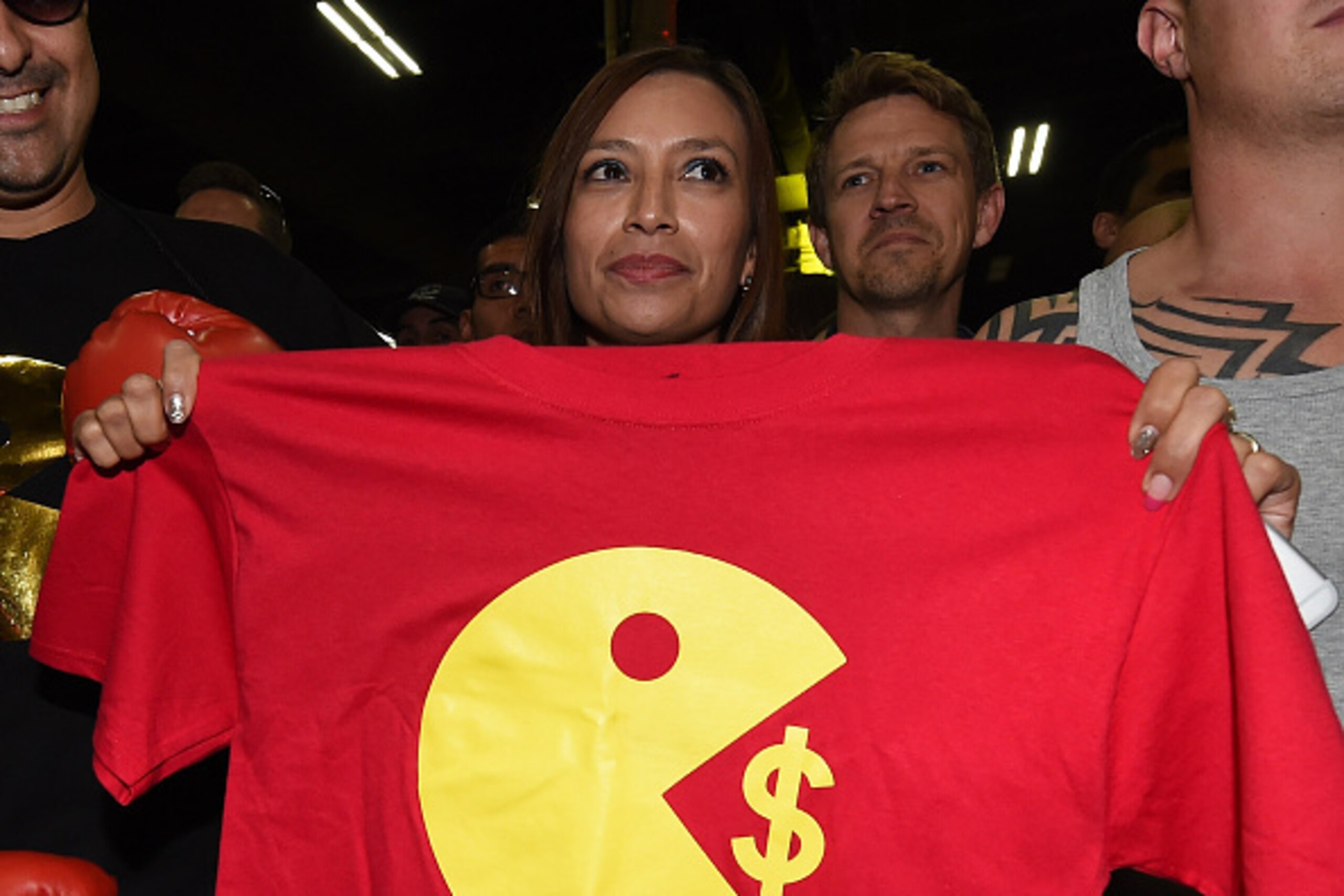 LAS VEGAS, NV - APRIL 28:  Norma Zavala of California holds a T-shirt supporting WBO welterweight champion Manny Pacquiao during a fan rally at the Mandalay Bay Convention Center on April 28, 2015 in Las Vegas, Nevada. Pacquiao will face WBC/WBA welterwei