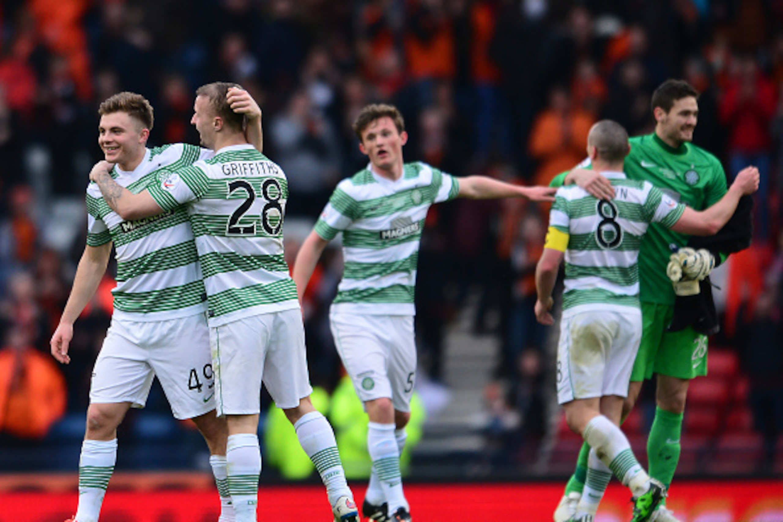 GLASGOW, SCOTLAND - MARCH 15 :  James Forrest and Leigh Griffiths of Celtic celebrate winning the League Cup during the Scottish League Cup Final between Dundee United and Celtic at Hamden Park on March 15, 2015 in Glasgow Scotland. (Photo by Mark Runnacl