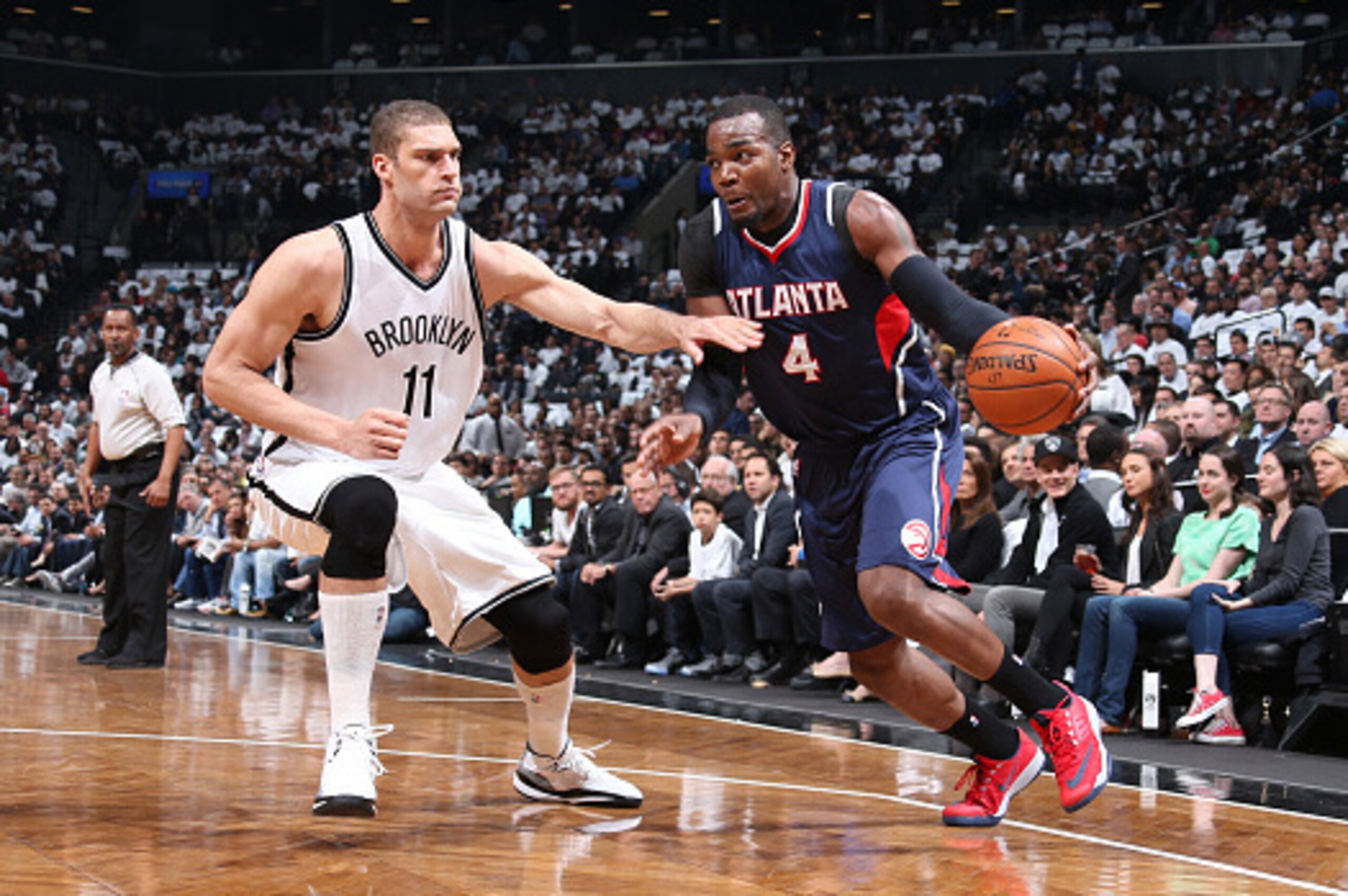 BROOKLYN, NY - APRIL 27: Paul Millsap #4 of the Atlanta Hawks drives to the basket against the Brook Lopez #11 of the Brooklyn Nets during Game Four of the Eastern Conference Quarterfinals during the NBA Playoffs on April 27, 2015 at Barclays Center in Br