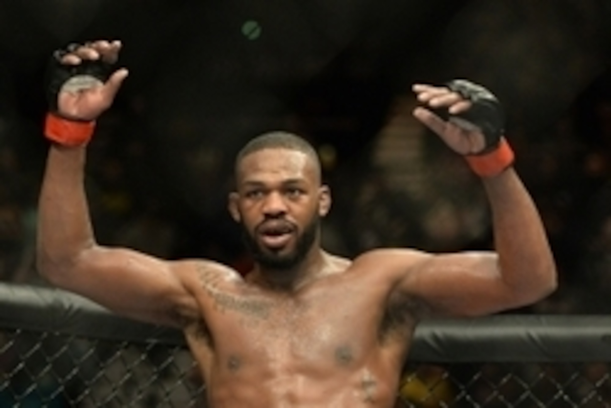 Jan 3, 2015; Las Vegas, NV, USA; Jon Jones (red gloves) celebrates after defeating Daniel Cormier (not pictured) in their light heavyweight title fight at UFC 182 at the MGM Grand Garden Arena. Jones won. Mandatory Credit: Jayne Kamin-Oncea-USA TODAY Spor