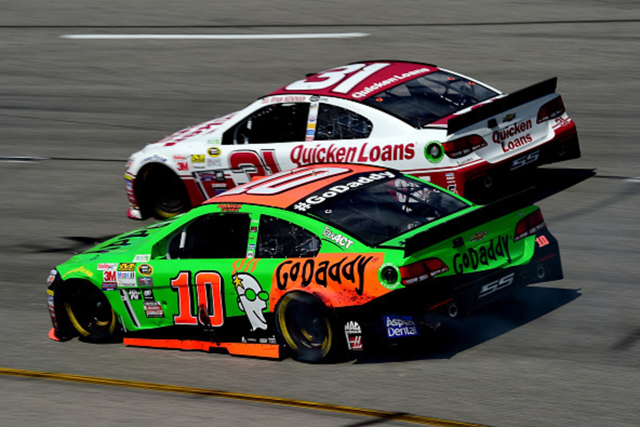 RICHMOND, VA - APRIL 26: Danica Patrick, driver of the #10 GoDaddy.com Chevrolet, and Ryan Newman, driver of the #31 Quicken Loans Chevrolet, race during the NASCAR Sprint Cup Series Toyota Owners 400 at Richmond International Raceway on April 26, 2015 in