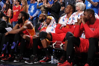 DALLAS, TX - APRIL 26:  (L-R) James Harden #13, Jason Terry #31, and Dwight Howard #12 of the Houston Rockets on the bench during the game against the Dallas Mavericks in Game Four of the Western Conference Quarterfinals during the 2015 NBA Playoffs on Ap