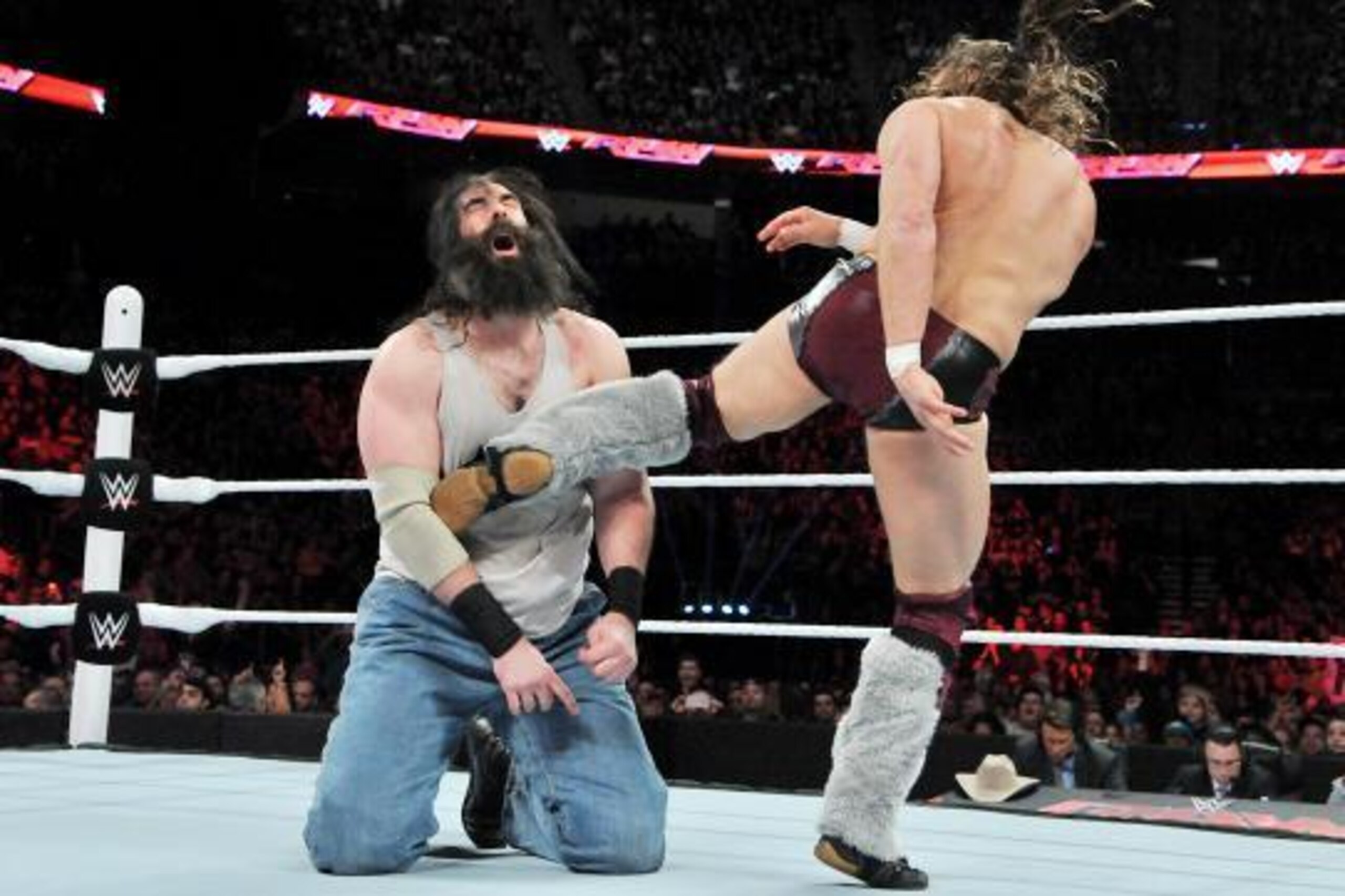 Daniel Bryan kicks Luke Harper.