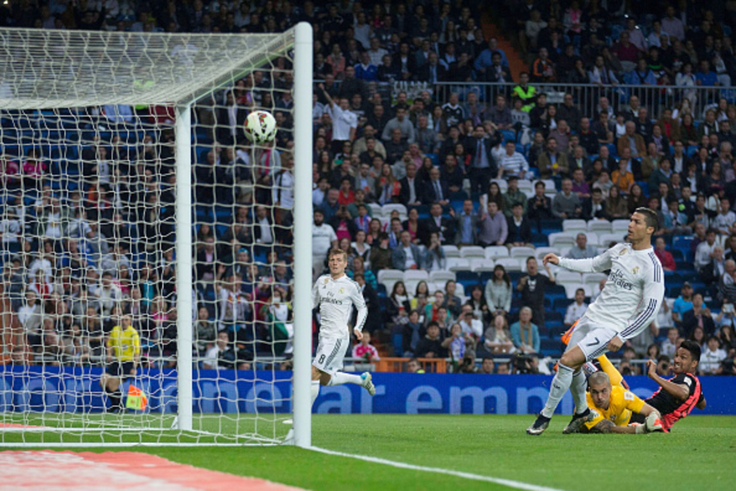 MADRID, SPAIN - APRIL 29: goalkeeper Ruben Martinez of Almeria UD scores a goal in his own goal close to Cristiano Ronaldo of Real Madrid CF giving tem their second goal during the La Liga match between Real Madrid CF and UD Almeria at Estadio Santiago Be MADRID, SPAIN - APRIL 29: goalkeeper Ruben Martinez of Almeria UD scores a goal in his own goal close to Cristiano Ronaldo of Real Madrid CF giving tem their second goal during the La Liga match between Real Madrid CF and UD Almeria at Estadio Santiago Be