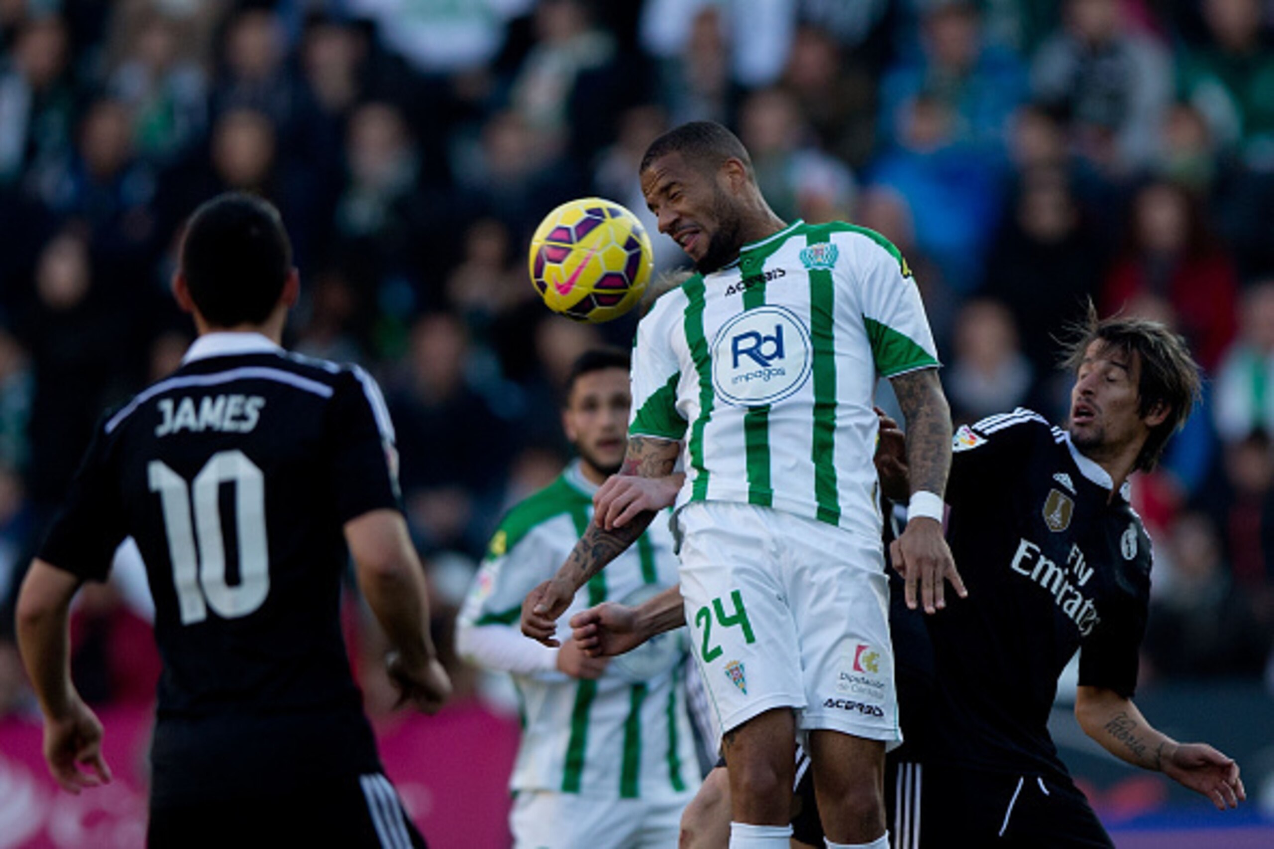 CORDOBA, SPAIN - JANUARY 24: Tiago Manuel Dias Correia of Cordoba CF wins the header after Fabio Coentrao of Real Madrid CF during the La Liga match between Cordoba CF and Real Madrid CF at El Arcangel stadium on January 24, 2015 in Cordoba, Spain.  (Phot
