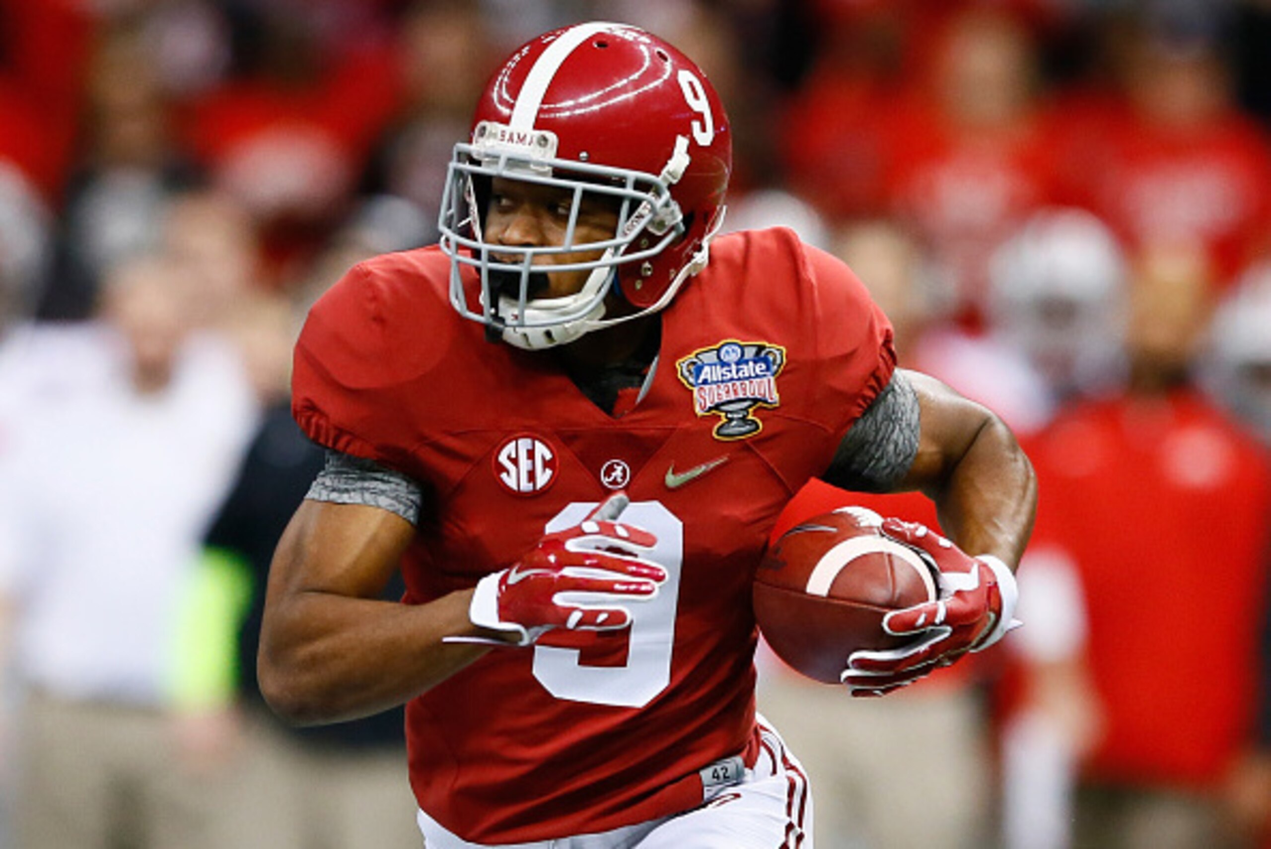 NEW ORLEANS, LA - JANUARY 01:  Amari Cooper #9 of the Alabama Crimson Tide runs the ball in the first quarter against the Ohio State Buckeyes during the All State Sugar Bowl at the Mercedes-Benz Superdome on January 1, 2015 in New Orleans, Louisiana.  (Ph