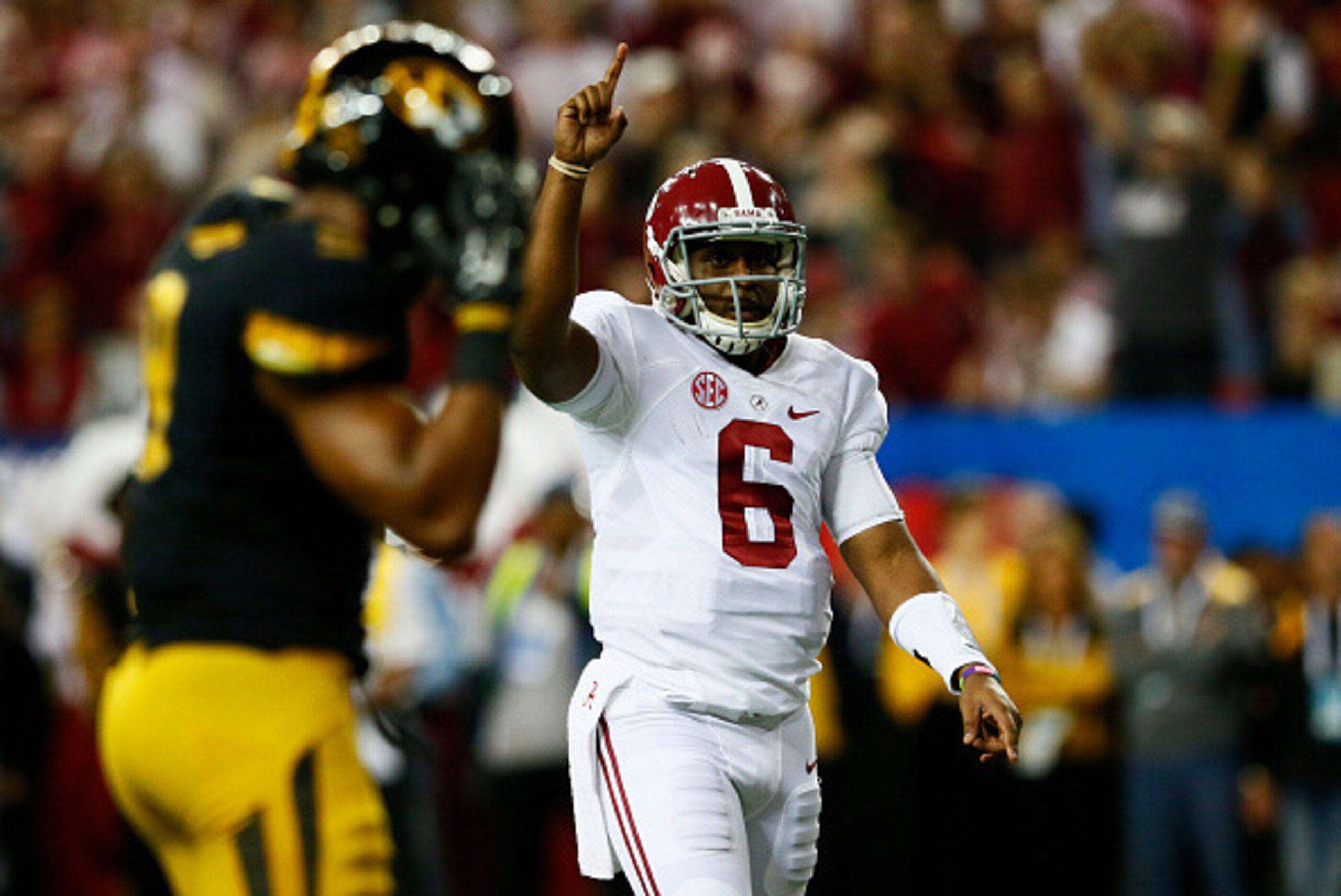 ATLANTA, GA - DECEMBER 06:  Blake Sims #6 of the Alabama Crimson Tide celebrates a touchdown by T.J. Yeldon #4 against the Missouri Tigers in the second quarter of the SEC Championship game at the Georgia Dome on December 6, 2014 in Atlanta, Georgia.  (Ph