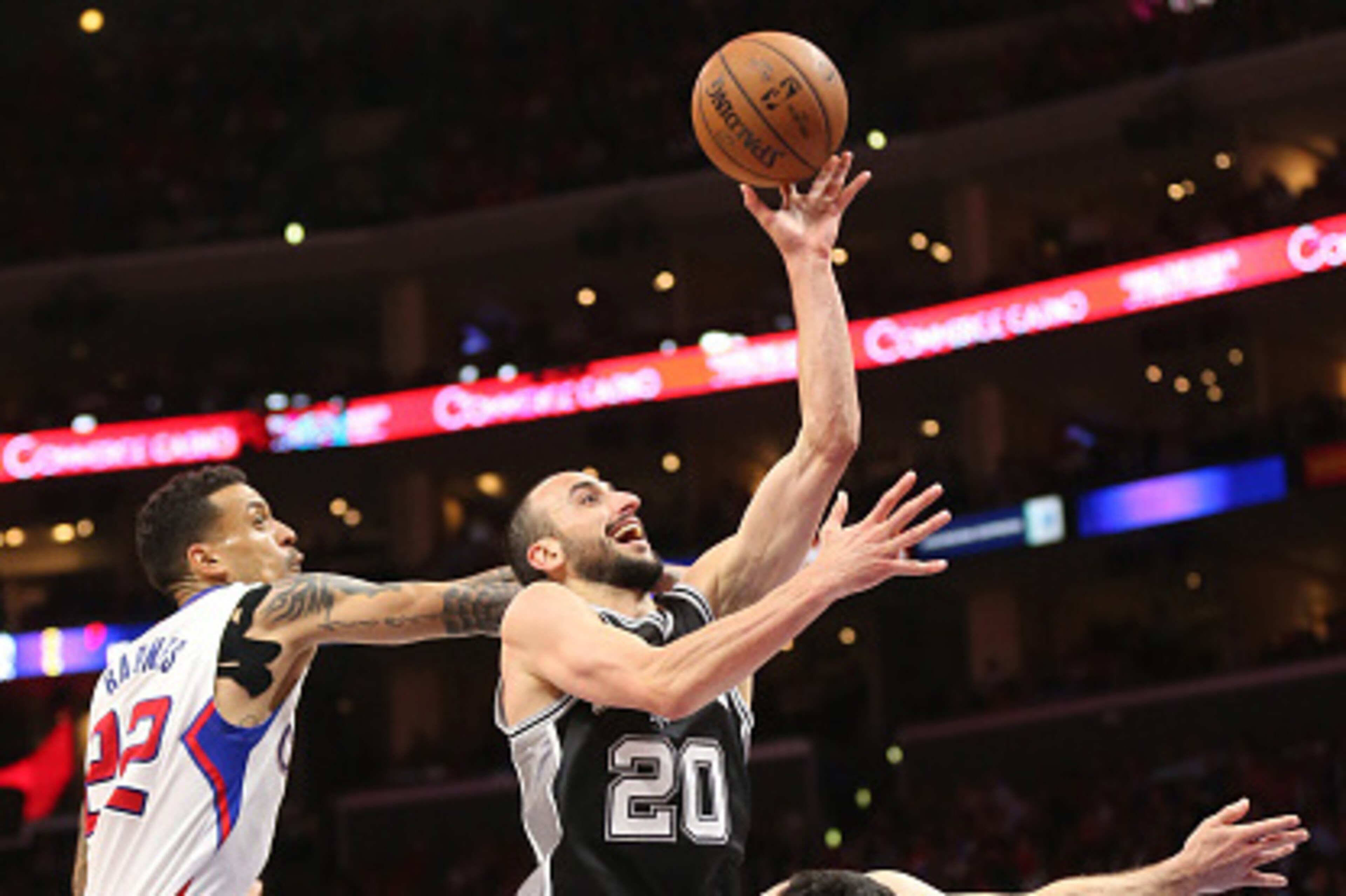 LOS ANGELES, CA - APRIL 28: Manu Ginobili #20 of the San Antonio Spurs shoots against J.J. Redick # and Matt Barnes #22 of the Los Angeles Clippers during Game Five of the Western Conference quarterfinals of the 2015 NBA Playoffs at Staples Center on Apri