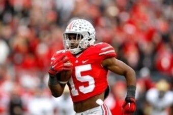 Nov 29, 2014; Columbus, OH, USA; Ohio State Buckeyes running back Ezekiel Elliott (15) breaks free for a touchdown versus the Michigan Wolverines during the second half of the Buckeyes 42-28 win at Ohio Stadium. Mandatory Credit: Joe Maiorana-USA TODAY Sp