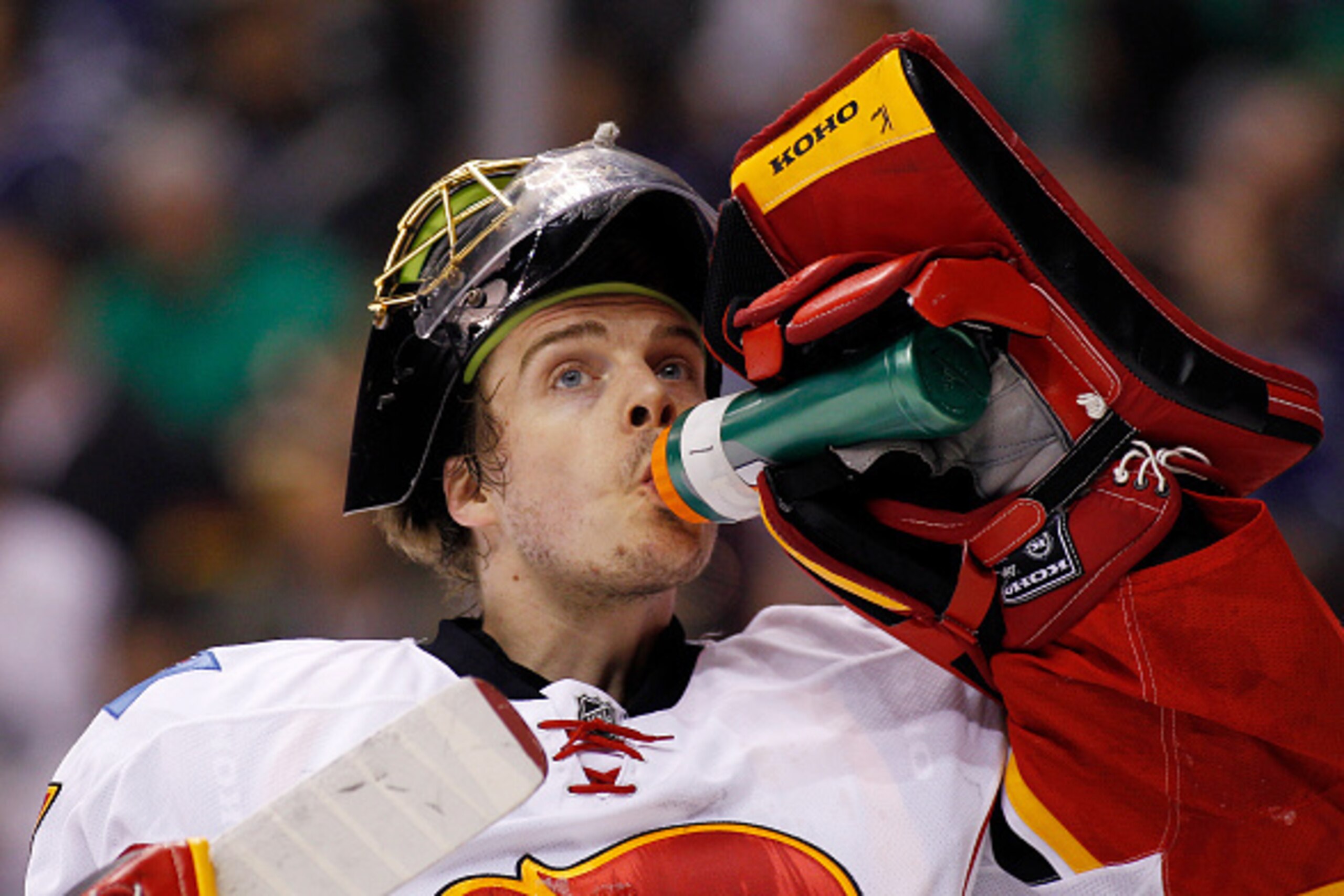 VANCOUVER, BC - APRIL 23: Goaltender Jonas Hiller #1 of the Calgary Flames drinks water during a break between play while facing the Vancouver Canucks during Game Five of the Western Conference Quarterfinals during the 2015 NHL Stanley Cup Playoffs at Rog