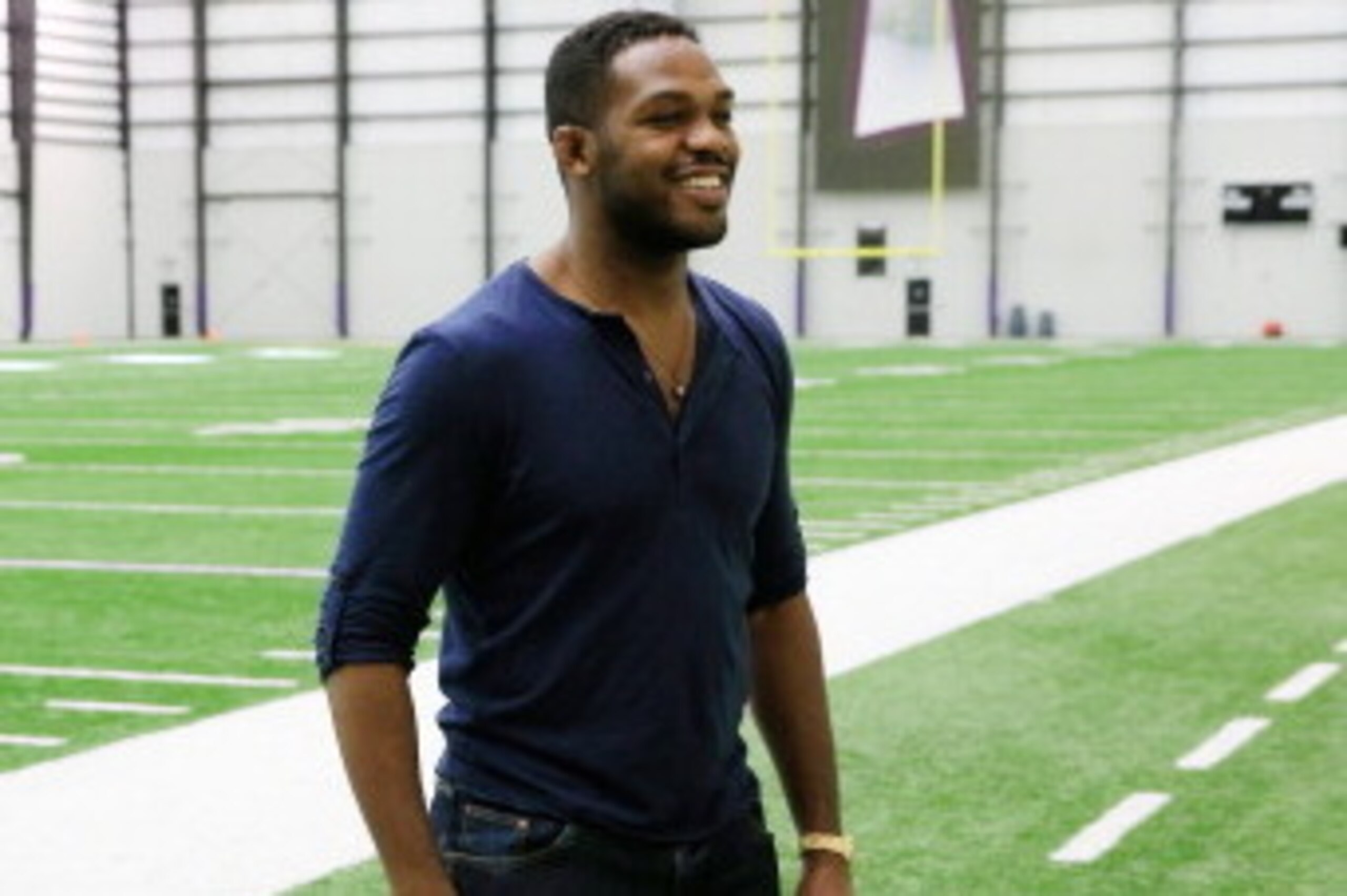 OWINGS MILLS, MD - NOVEMBER 13:  UFC fighter Jon Jones waits to be interviewed after attending a news conference with his brother defensive end Arthur Jones #97 of the Baltimore Ravens (not pictured) during a  at the teams training facility November 13, 2