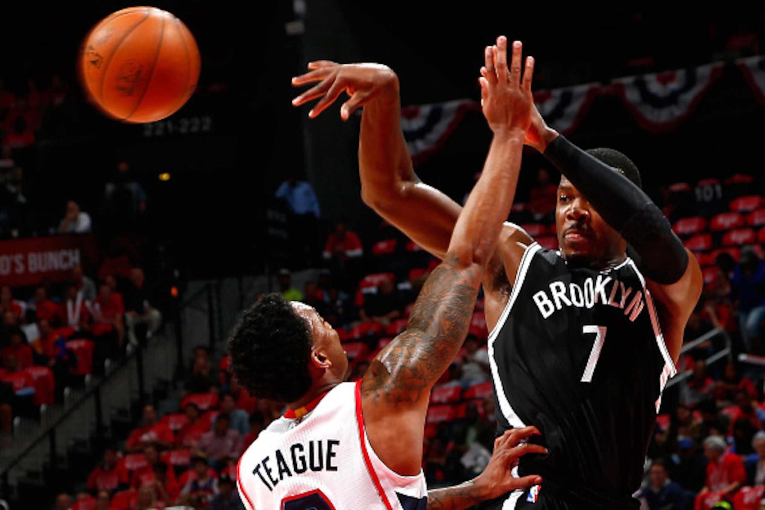 ATLANTA, GA - APRIL 29: Joe Johnson #7 of the Brooklyn Nets passes against Jeff Teague #0 of the Atlanta Hawks during Game Five of the Eastern Conference Quarterfinals of the NBA Playoffs at Philips Arena on April 29, 2015 in Atlanta, Georgia. NOTE TO U ATLANTA, GA - APRIL 29: Joe Johnson #7 of the Brooklyn Nets passes against Jeff Teague #0 of the Atlanta Hawks during Game Five of the Eastern Conference Quarterfinals of the NBA Playoffs at Philips Arena on April 29, 2015 in Atlanta, Georgia. NOTE TO U