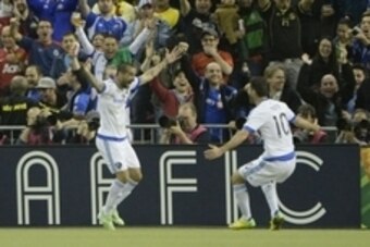 Apr 29, 2015; Montreal, Quebec, Canada; Montreal Impact forward Andres Romero (15) reacts with teammate Montreal Impact midfielder Ignacio Piatti (10) after scoring a goal against Club America  against Club America during the first half of the second leg 