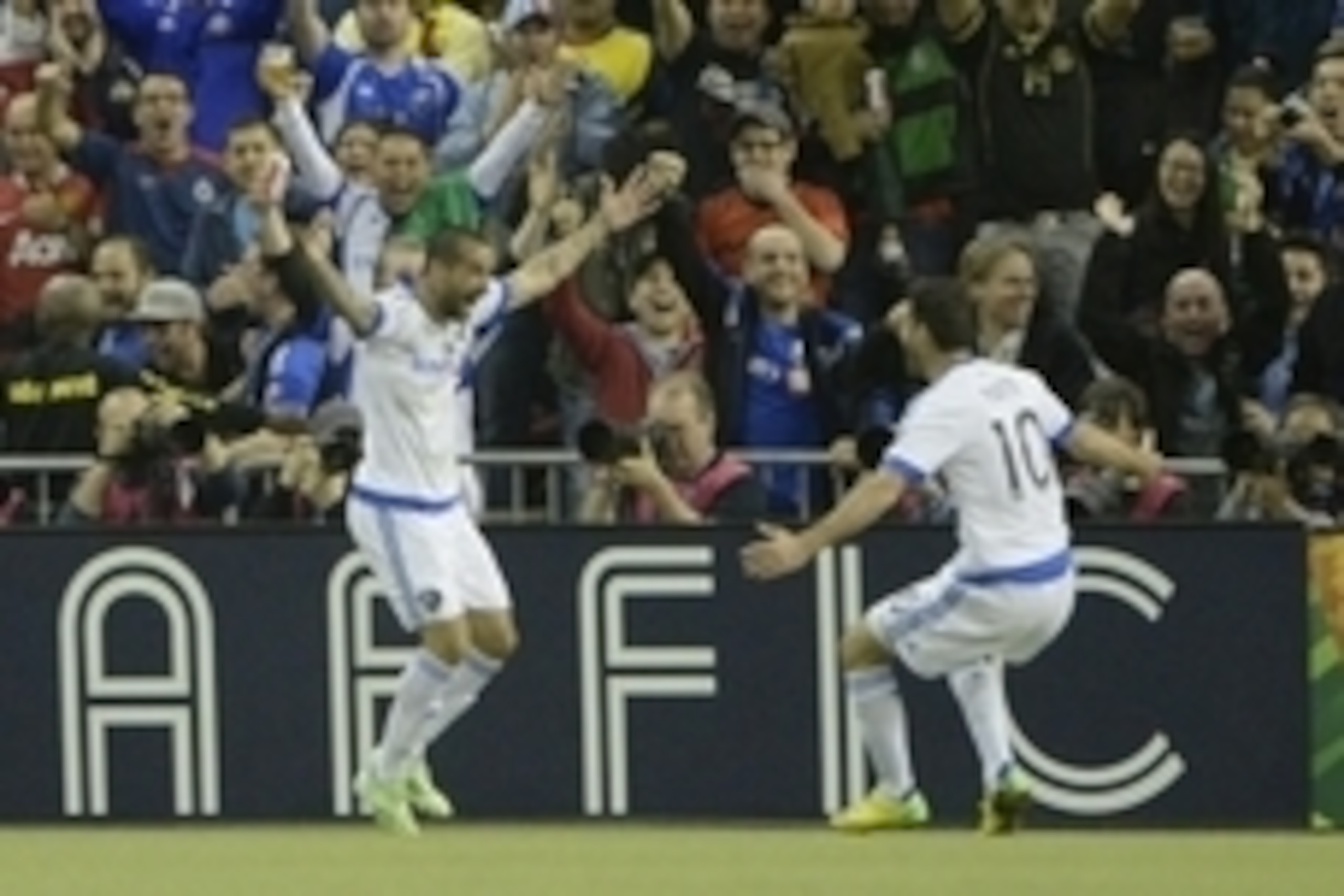 Apr 29, 2015; Montreal, Quebec, Canada; Montreal Impact forward Andres Romero (15) reacts with teammate Montreal Impact midfielder Ignacio Piatti (10) after scoring a goal against Club America  against Club America during the first half of the second leg 