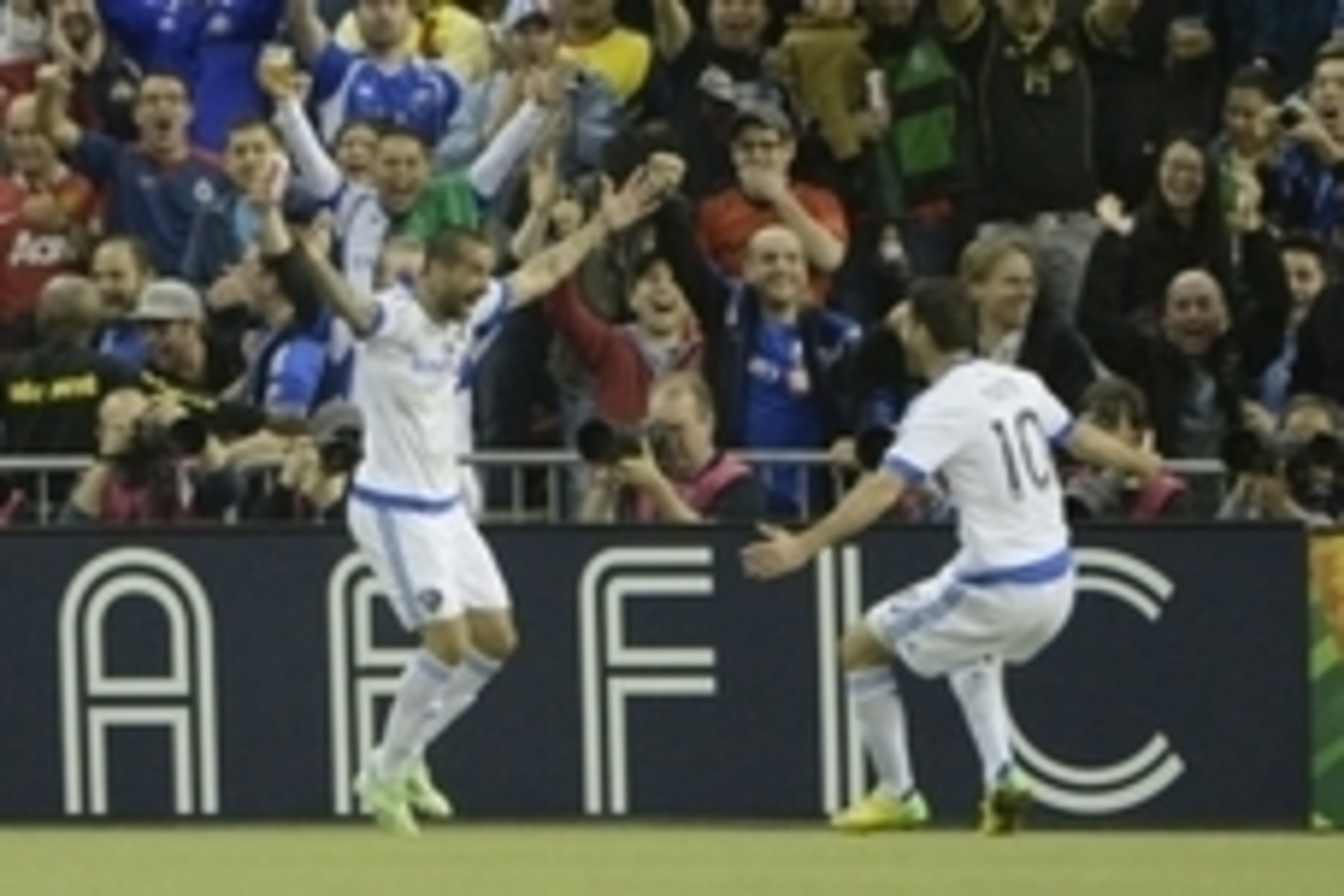 Apr 29, 2015; Montreal, Quebec, Canada; Montreal Impact forward Andres Romero (15) reacts with teammate Montreal Impact midfielder Ignacio Piatti (10) after scoring a goal against Club America  against Club America during the first half of the second leg 