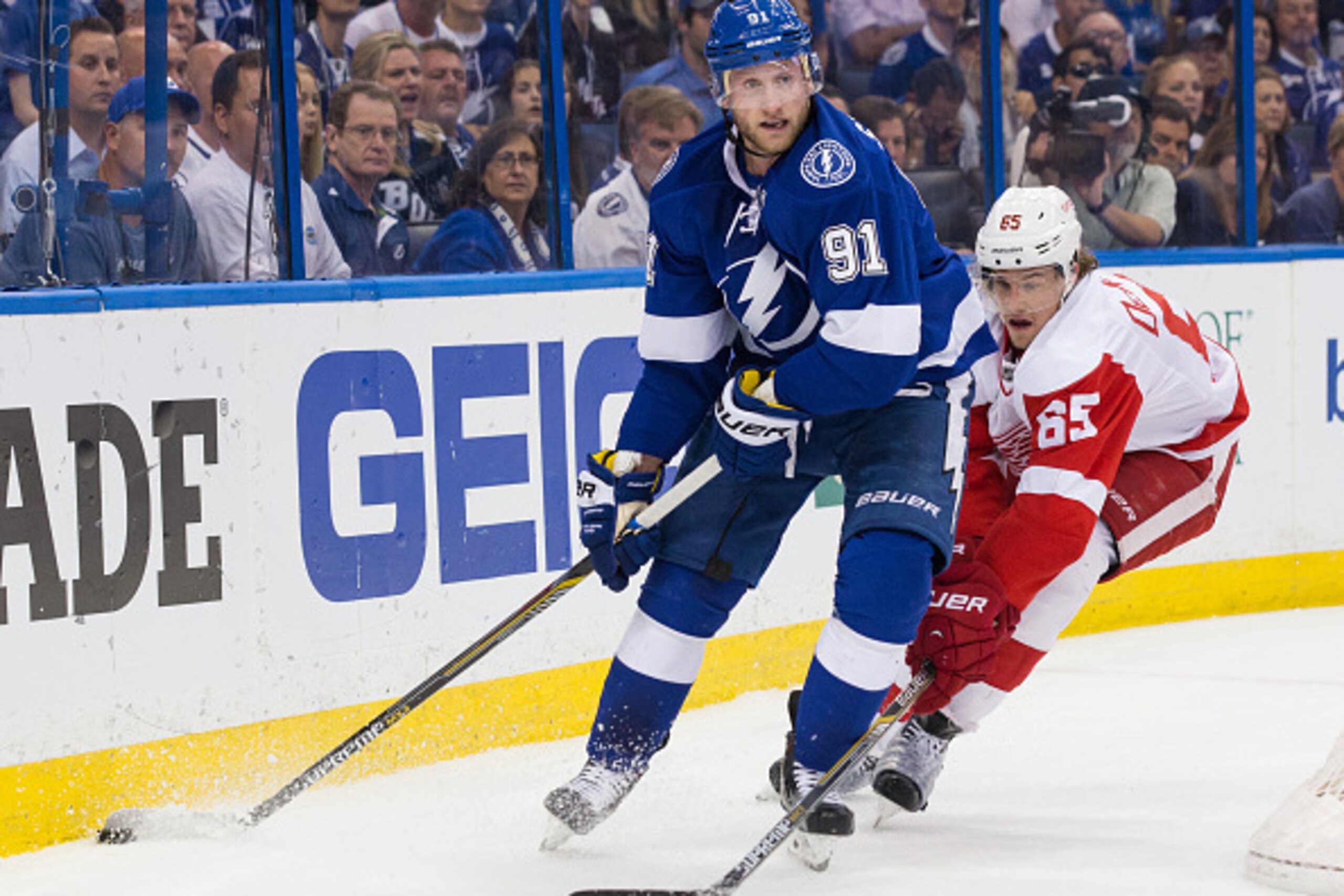 TAMPA, FL - APRIL 29: Steven Stamkos #91 of the Tampa Bay Lightning controls the puck against Danny DeKeyser #65 of the Detroit Red Wings during the first period of Game Seven of the Eastern Conference Quarterfinals during the 2015 NHL Stanley Cup Playoff