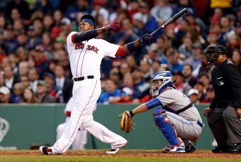 Apr 29, 2015; Boston, MA, USA; Boston Red Sox left fielder Hanley Ramirez (13) hits a two run home run off Toronto Blue Jays pitcher R.A. Dickey (not pictured) during the third inning at Fenway Park. Mandatory Credit: Greg M. Cooper-USA TODAY Sports