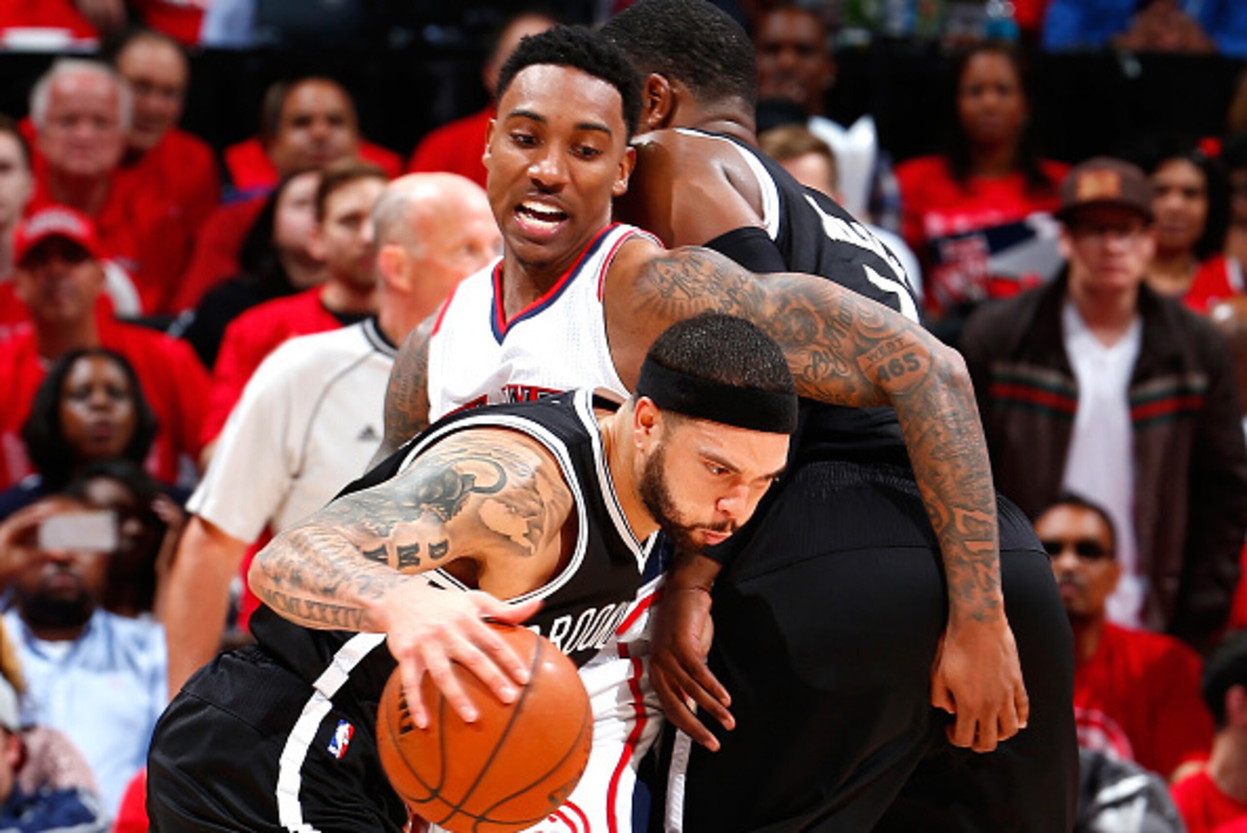 ATLANTA, GA - APRIL 29:  Joe Johnson #7 of the Brooklyn Nets sets a screen as Deron Williams #8 drives around Jeff Teague #0 of the Atlanta Hawks during Game Five of the Eastern Conference Quarterfinals of the NBA Playoffs at Philips Arena on April 29, 20