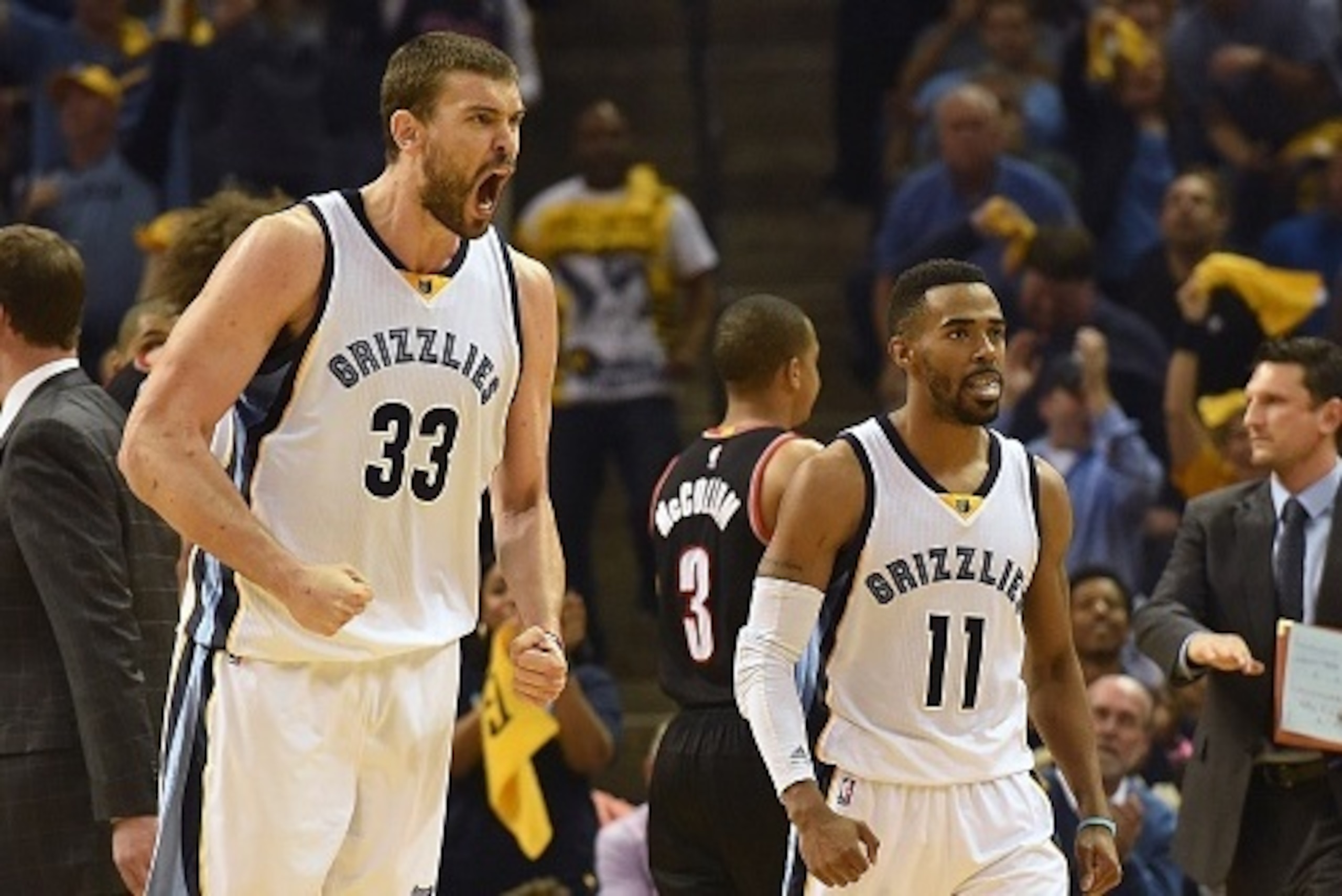 MEMPHIS, TN - APRIL 22:  Marc Gasol #33 and Mike Conley #11 of the Memphis Grizzlies react to the croud during a timeout against the Portland Trailblazers during the first quarter of Game Two of the first round of the NBA Playoffs at FedExForum on April 2
