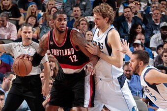 DALLAS, TX - APRIL 15: LaMarcus Aldridge #12 of the Portland Trail Blazers posts up against Dirk Nowitzki #41 of the Dallas Mavericks on April 15, 2015 at the American Airlines Center in Dallas, Texas. NOTE TO USER: User expressly acknowledges and agrees 