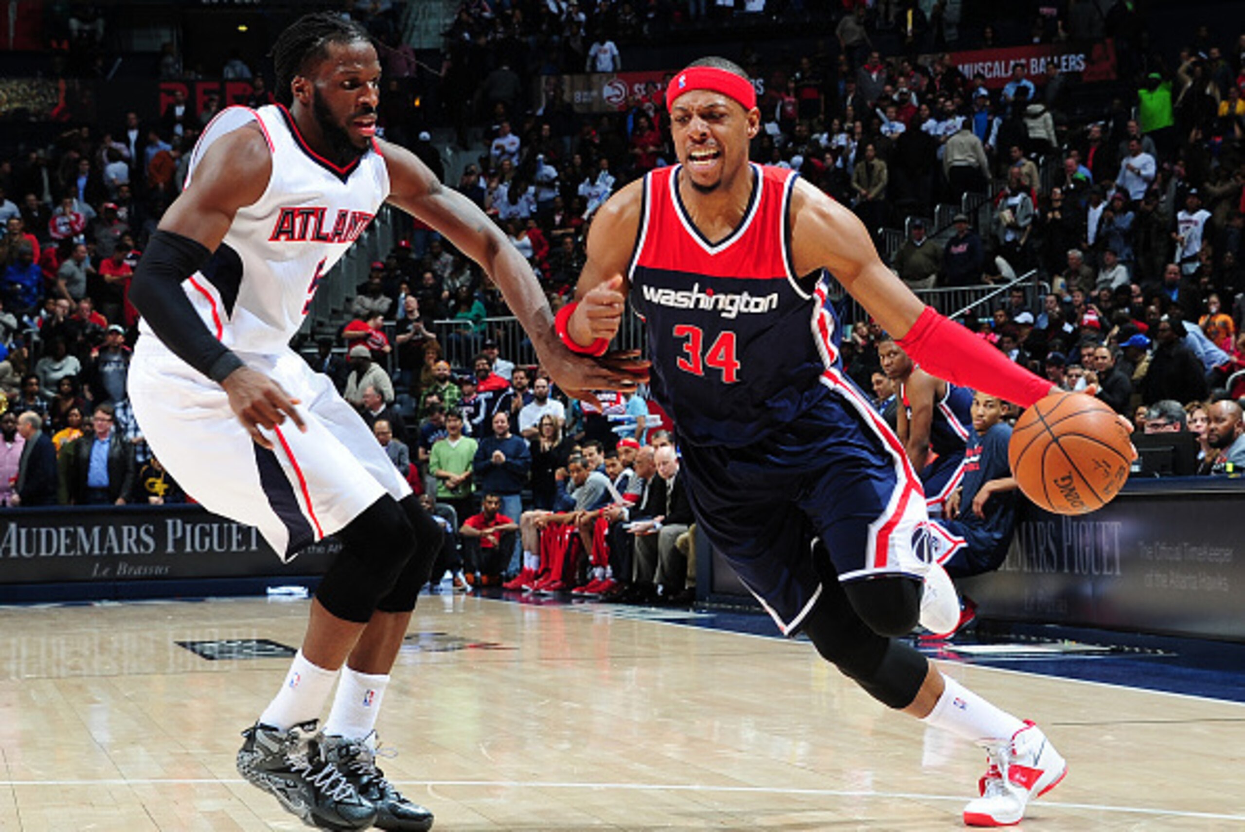 ATLANTA, GA - FEBRUARY 4: Paul Pierce #34 of the Washington Wizards drives against DeMarre Carroll #5 of the Atlanta Hawks on February 4, 2015 at Philips Arena in Atlanta, Georgia.  NOTE TO USER: User expressly acknowledges and agrees that, by downloading