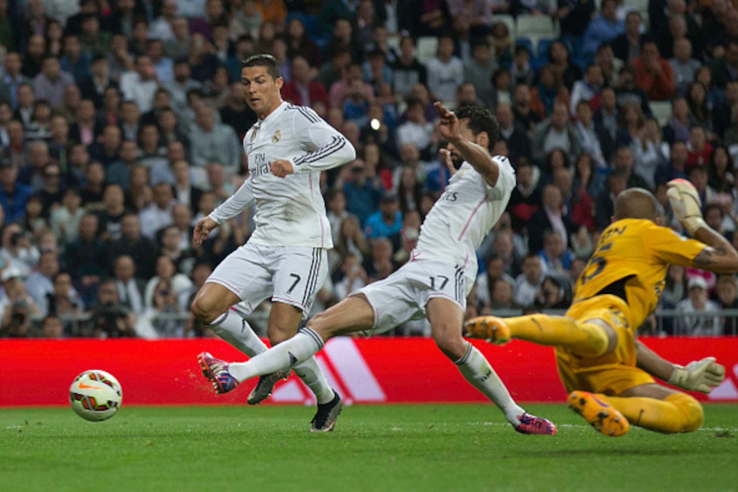 MADRID, SPAIN - APRIL 29:  Alvaro Arbeloa (2ndR) of Real Madrid CF scores their third goal close to his teammate Cristiano Ronaldo (L) and over goalkeeper Ruben Martinez (R) of Almeria UD during the La Liga match between Real Madrid CF and UD Almeria at E