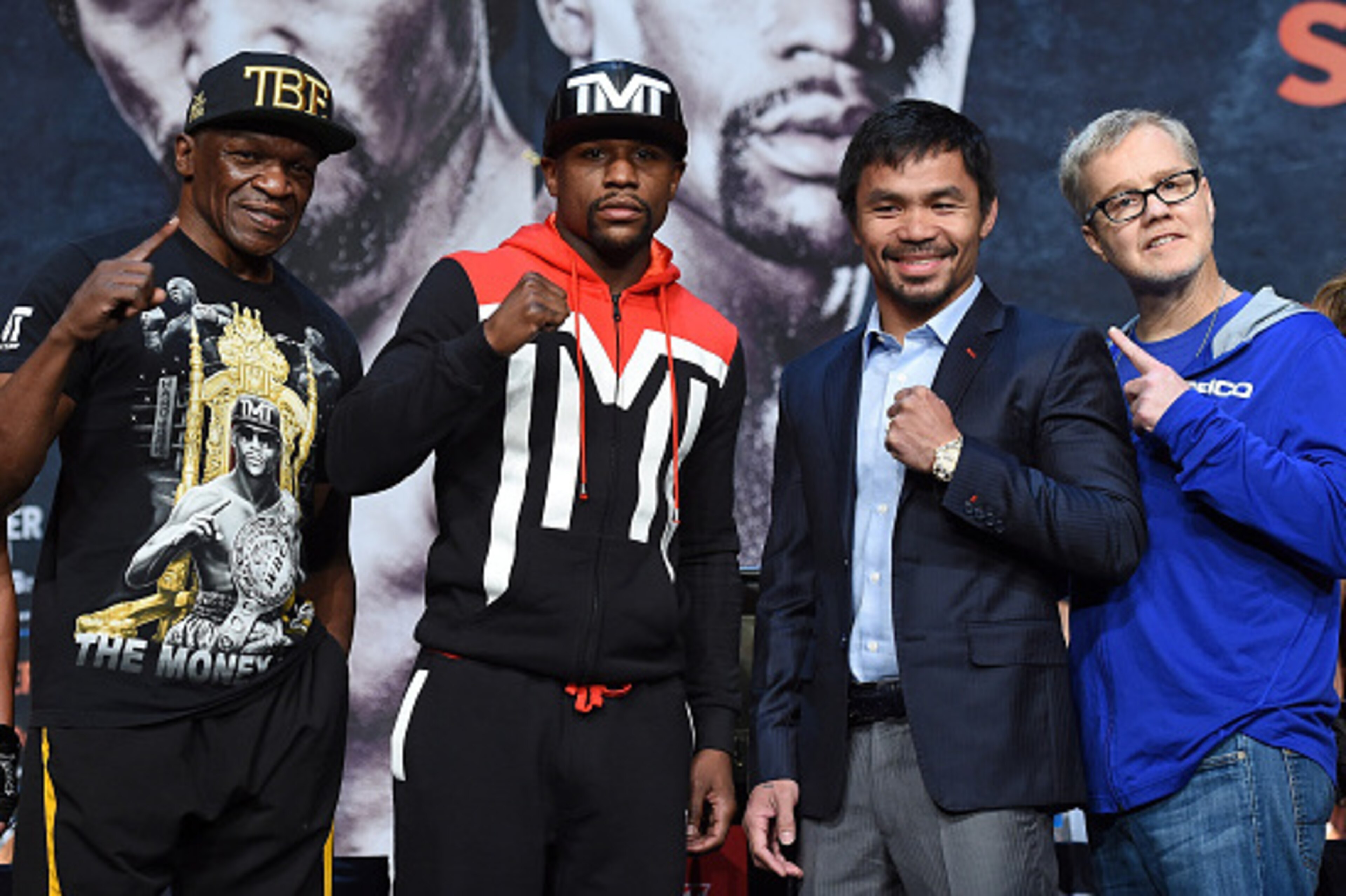 LAS VEGAS, NV - APRIL 29:  (L-R) Trainer Floyd Mayweather Sr., WBC/WBA welterweight champion Floyd Mayweather Jr., WBO welterweight champion Manny Pacquiao and trainer Freddie Roach pose during a news conference at the KA Theatre at MGM Grand Hotel & Casi