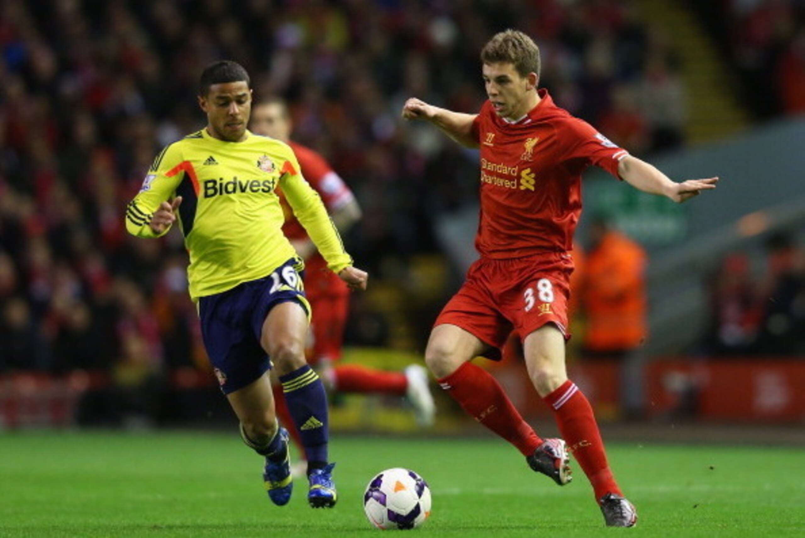 LIVERPOOL, ENGLAND - MARCH 26:  Jon Flanagan of Liverpool competes with Liam Bridcutt of Sunderland
 during the Barclays Premier League match between Liverpool and Sunderland at Anfield on March 26, 2014 in Liverpool, England.  (Photo by Alex Livesey/Gett