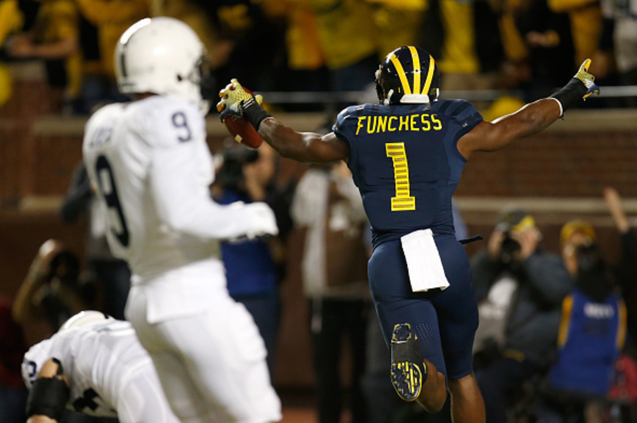ANN ARBOR, MI - OCTOBER 11:  Devin Funchess #1 of the Michigan Wolverines celebrates a first quarter touchdown behind Jordan Lucas #9 of the Penn State Nittany Lions on October 11, 2014 at Michigan Stadium in Ann Arbor, Michigan.  (Photo by Gregory Shamus