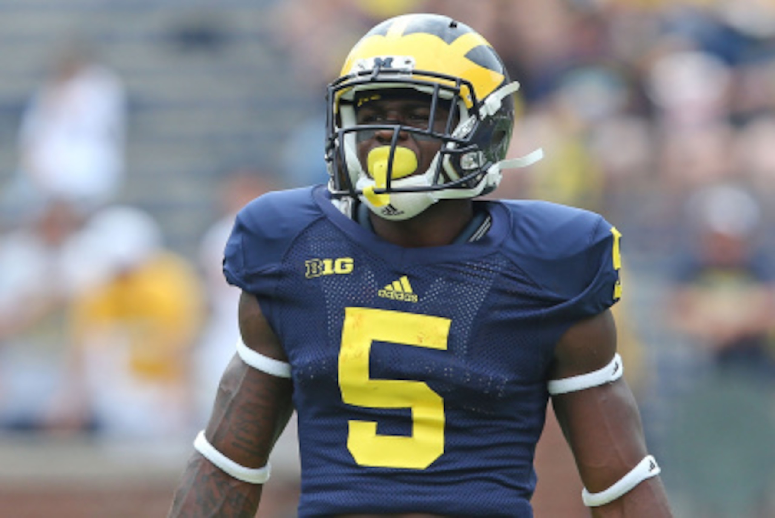 ANN ARBOR, MI - AUGUST 30:  Jabrill Peppers #5 of the Michigan Wolverines warms up prior to the start of the game against the Appalachian State Mountaineers on August 30, 2014 in Ann Arbor, Michigan. The Wolverines defeated the Mountaineers 52-14.  (Photo