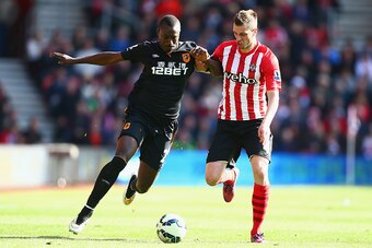 SOUTHAMPTON, ENGLAND - APRIL 11:  Liam Rosenior of Hull City holds off Morgan Schneiderlin of Southampton  during the Barclays Premier League match between Southampton and Hull City at St Mary's Stadium on April 11, 2015 in Southampton, England.  (Photo b