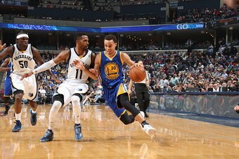 MEMPHIS, TN - MARCH 27:  Stephen Curry #30 of the Golden State Warriors drives to the basket against Mike Conley #11 of the Memphis Grizzlies on March 27, 2015 at FedExForum in Memphis, Tennessee. NOTE TO USER: User expressly acknowledges and agrees that,