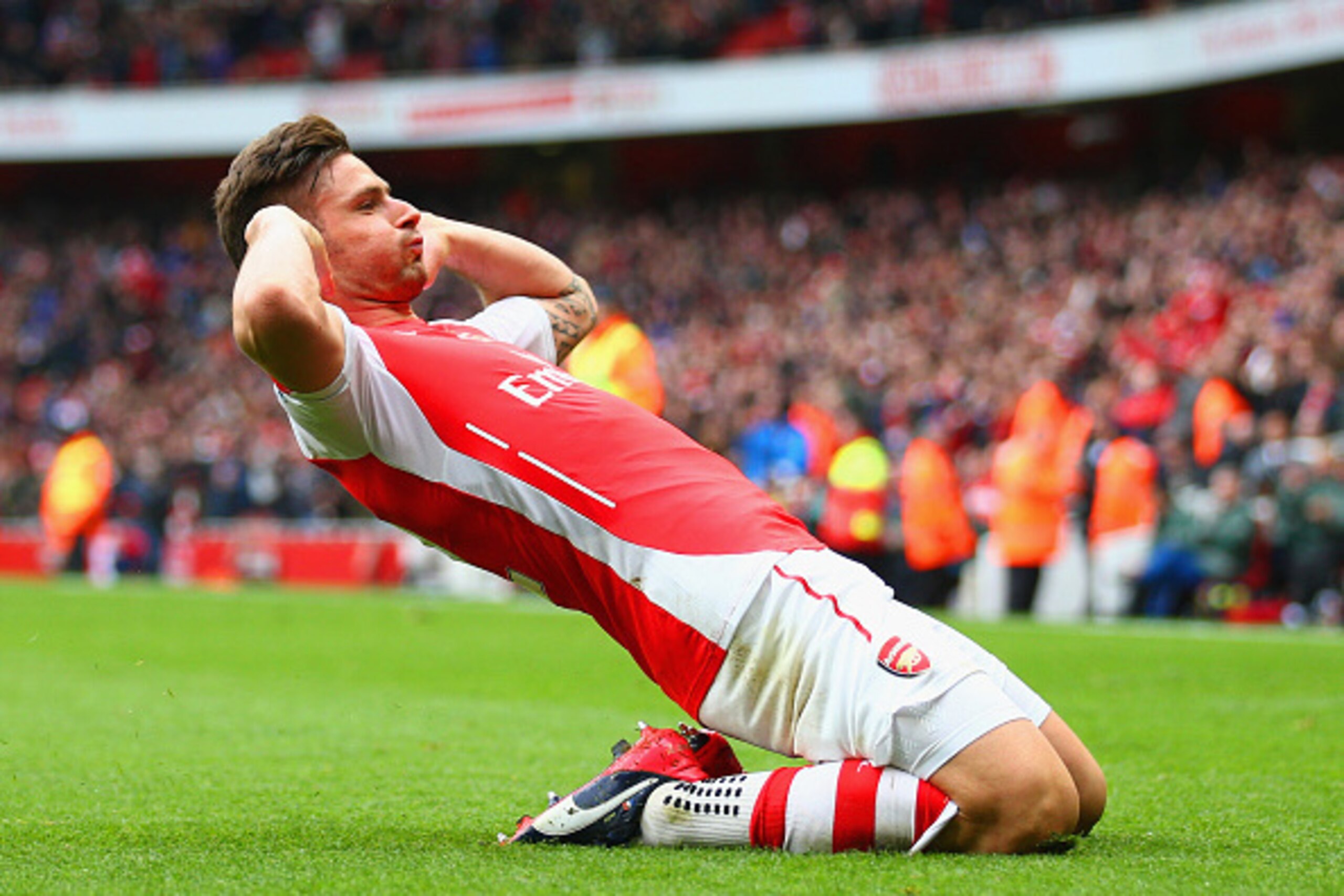 LONDON, ENGLAND - APRIL 04:  Olivier Giroud of Arsenal celebrates after scoring his team's fourth goal during the Barclays Premier League match between Arsenal and Liverpool at Emirates Stadium on April 4, 2015 in London, England.  (Photo by Paul Gilham/G