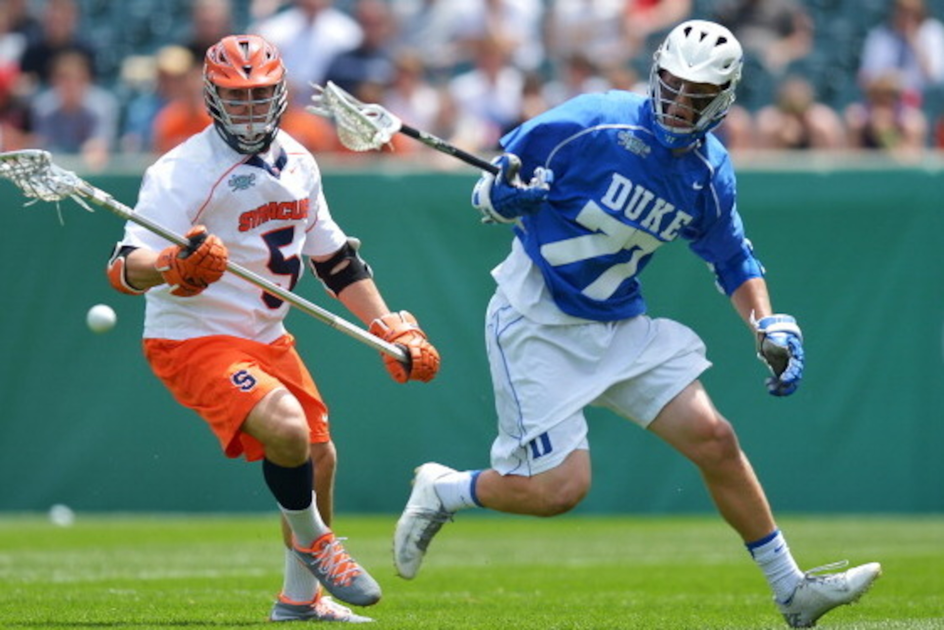 PHILADELPHIA, PA - MAY 27: Joe Fazio #5 of the Syracuse University Orange and Henry Lobb #77 of the Duke University Blue Devils scramble for a loose ball during the 2013 NCAA Division I Men's Lacrosse Championship at Lincoln Financial Field on May 27, 201 PHILADELPHIA, PA - MAY 27: Joe Fazio #5 of the Syracuse University Orange and Henry Lobb #77 of the Duke University Blue Devils scramble for a loose ball during the 2013 NCAA Division I Men's Lacrosse Championship at Lincoln Financial Field on May 27, 201